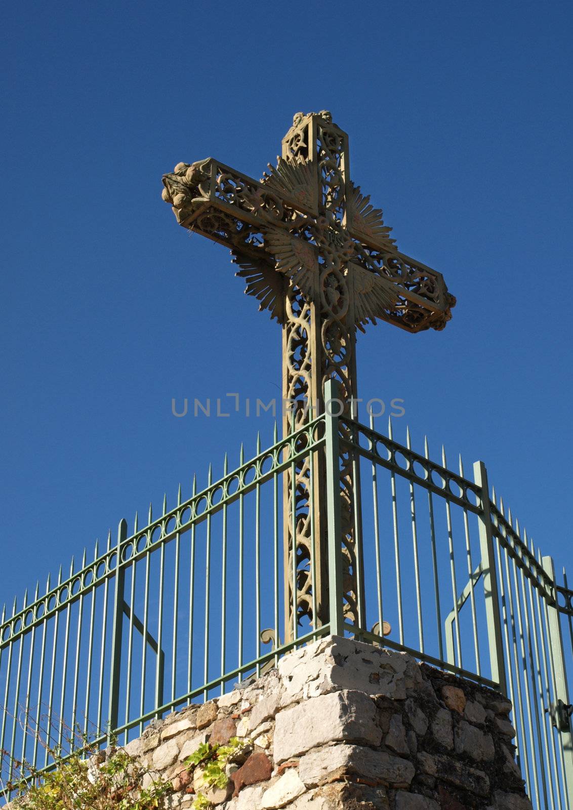 an image of a cross in the blue sky
