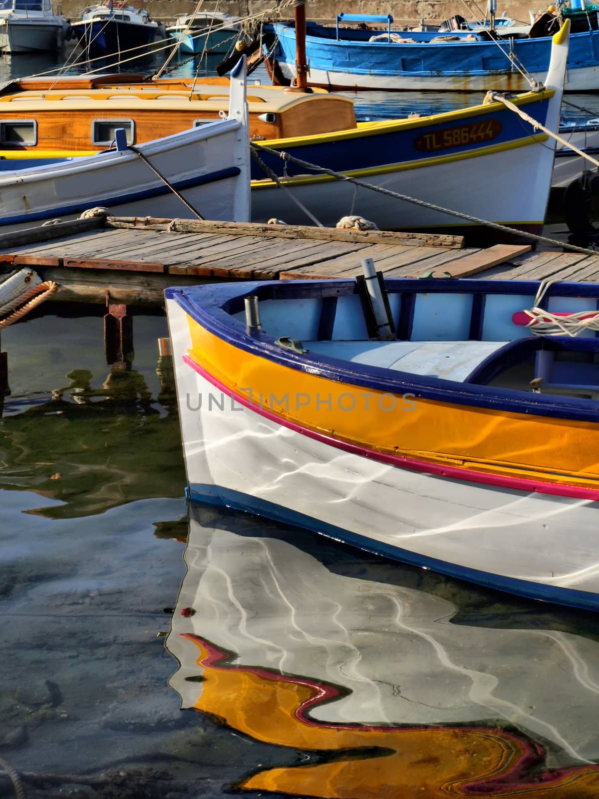 image of some fisher boats in a little provence harbor