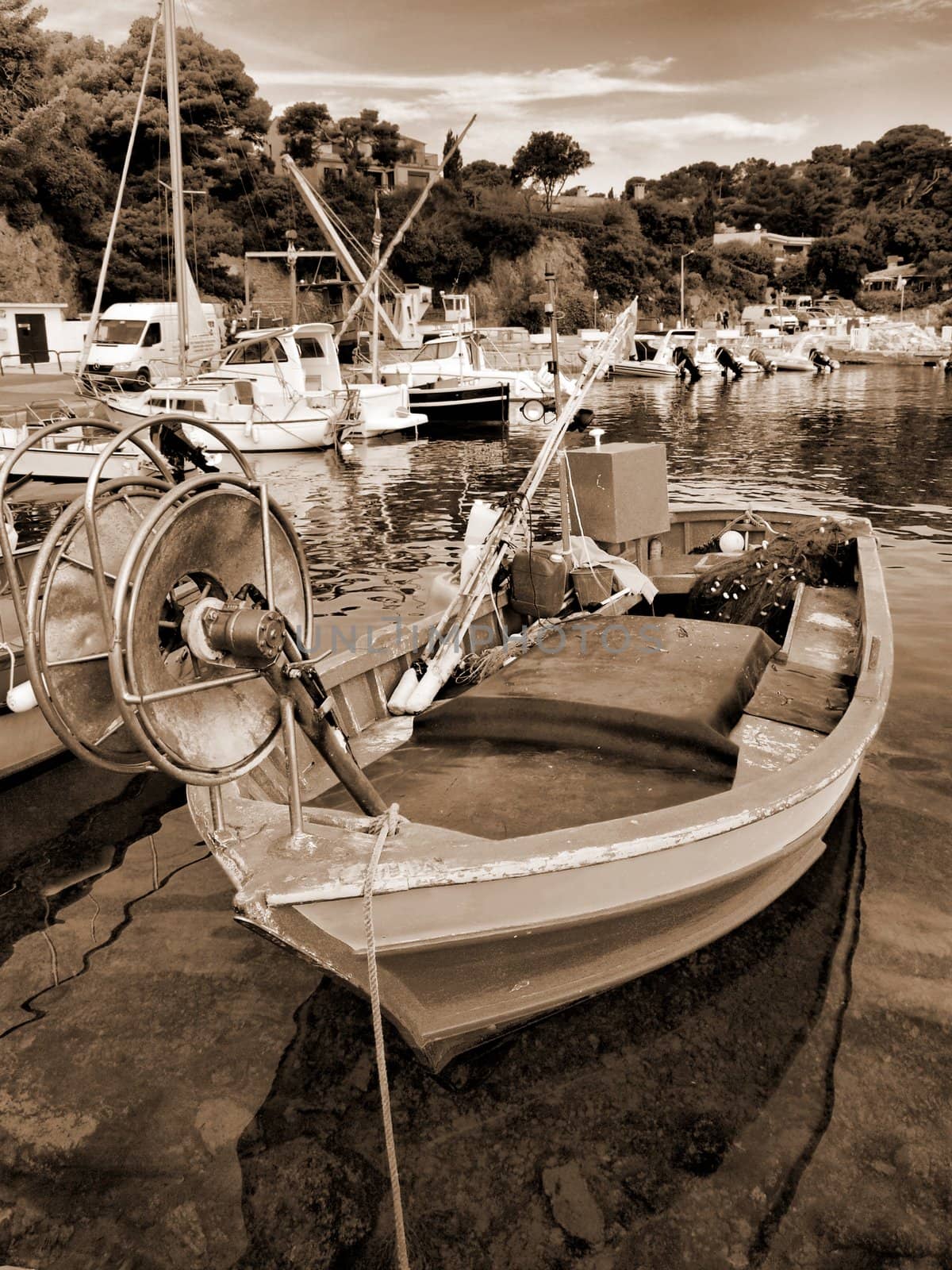 image of a fisher boat in a little provence harbor