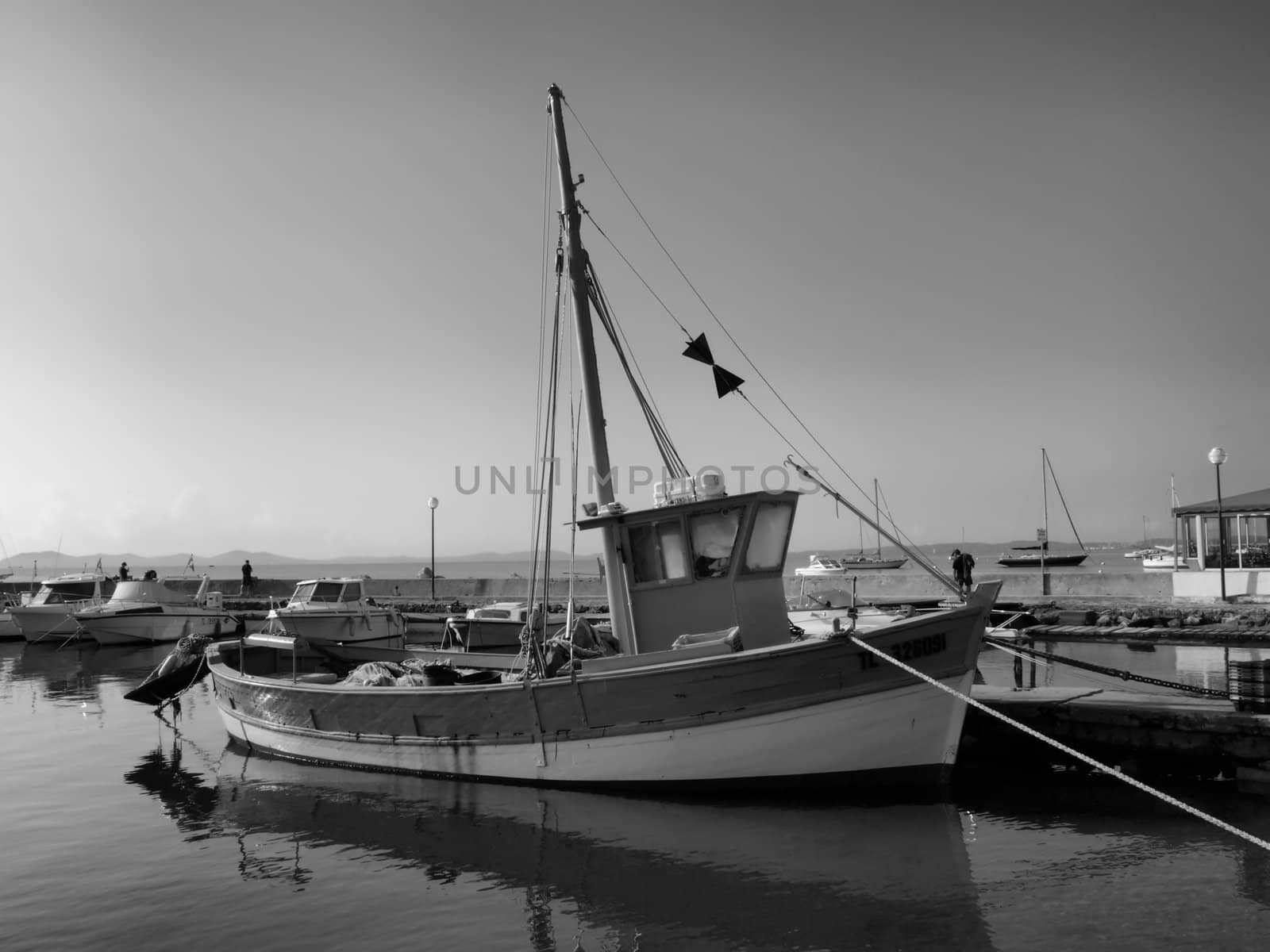 image of a fisher boat in a little provence harbor