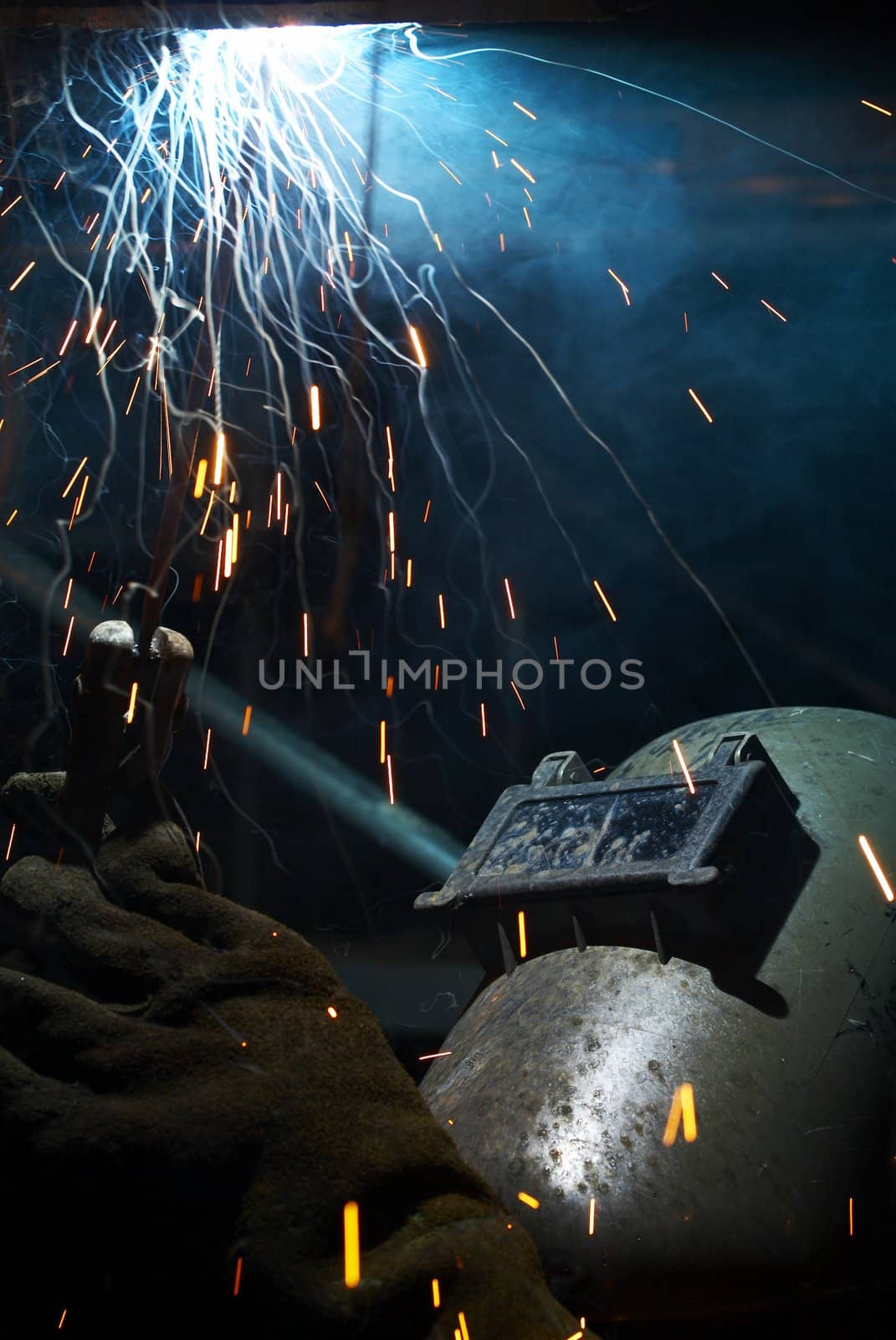 a picture of a welder working at night