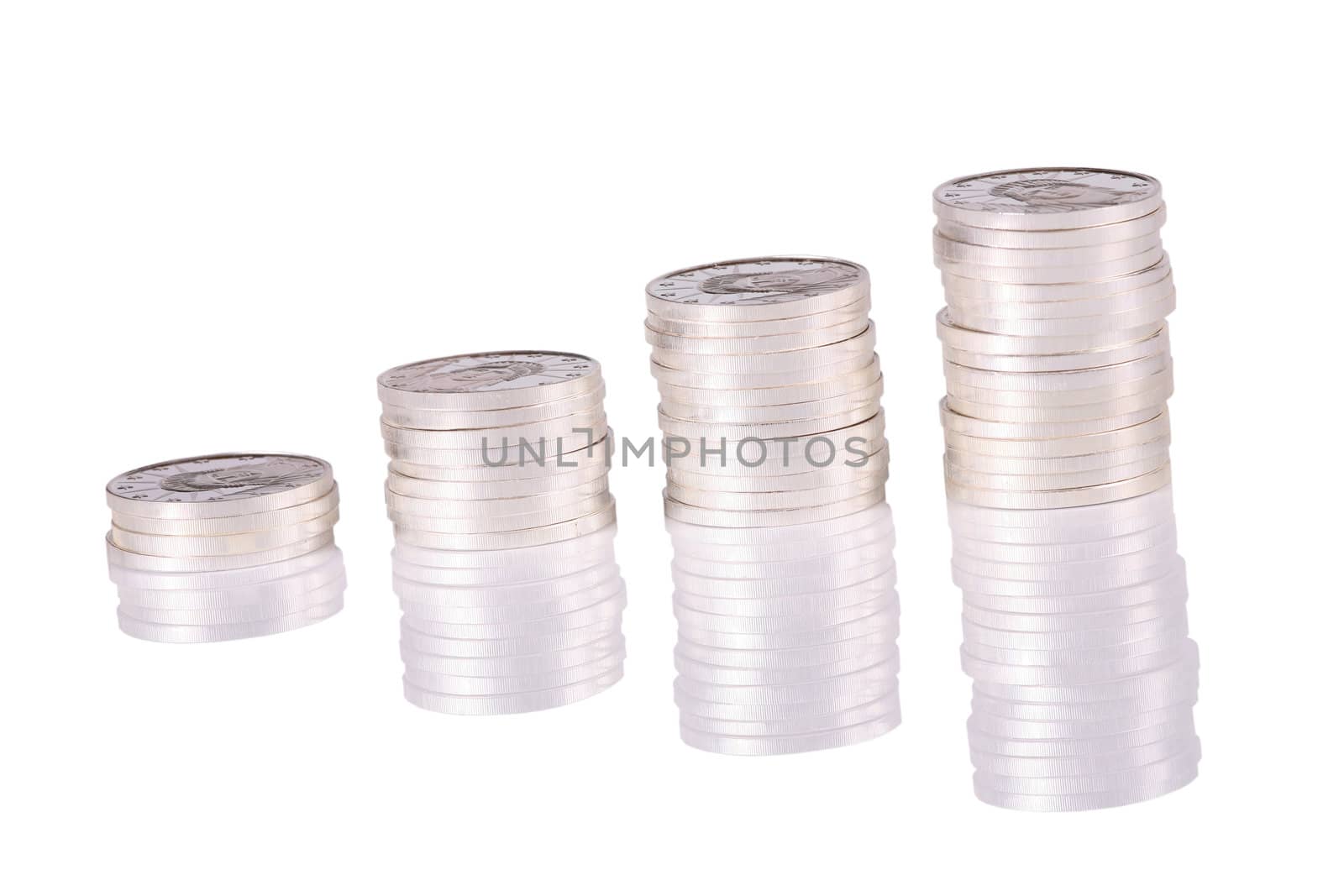 Stack of pure silver coins lineduponwhitewith reflections
