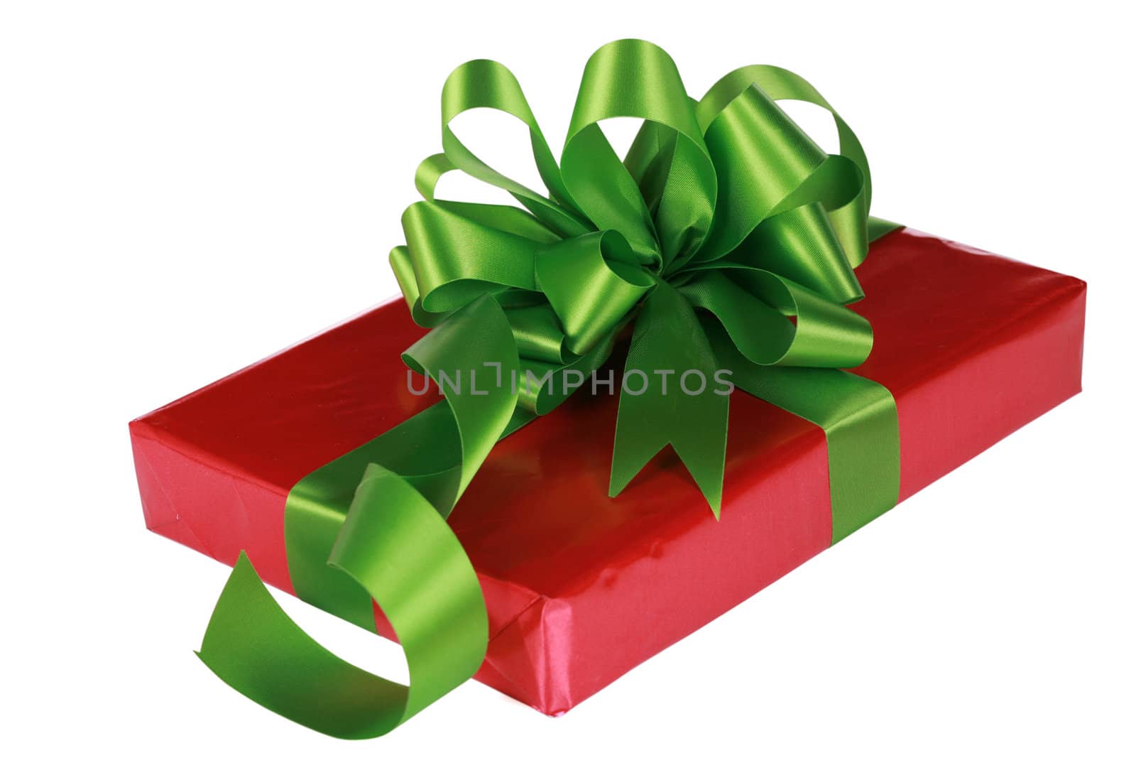 Red present with green ribbons and bow