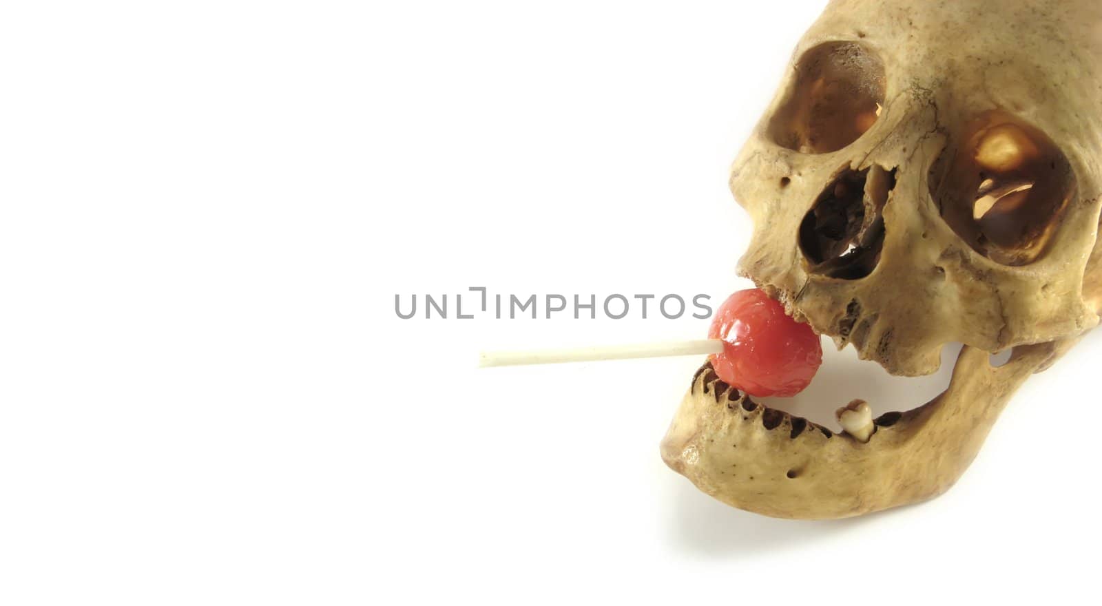 a halloween banner with skull and lollipop
