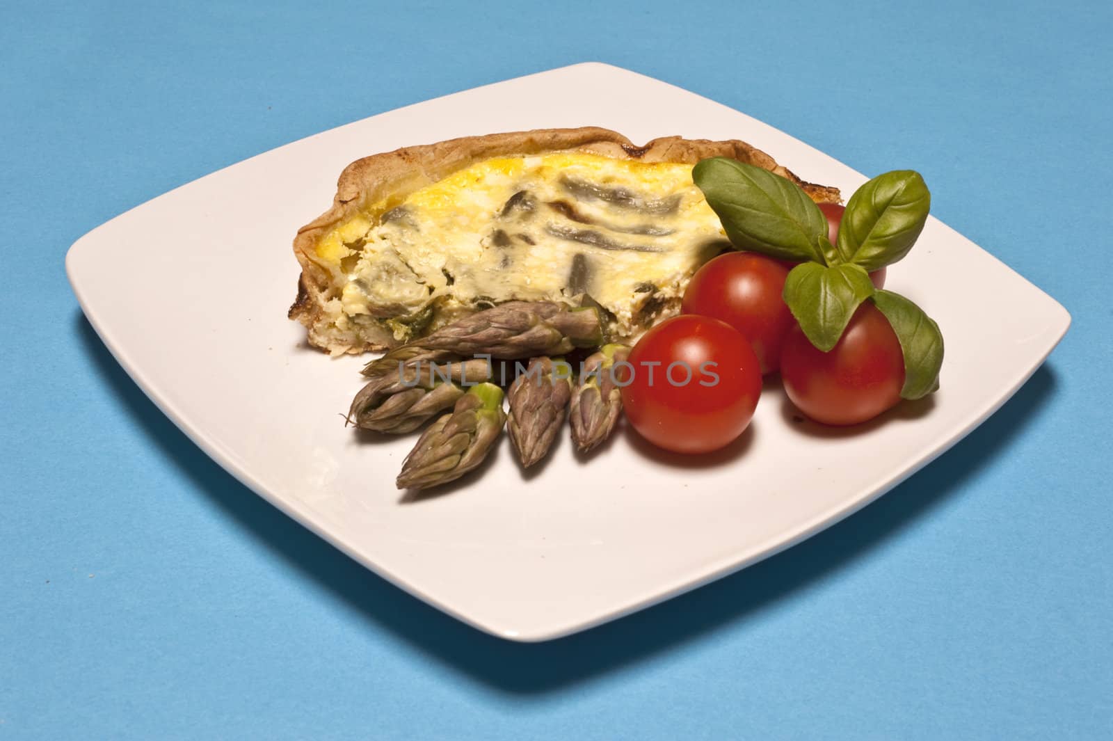 
Asparagus omelet served with tomatoes and basil