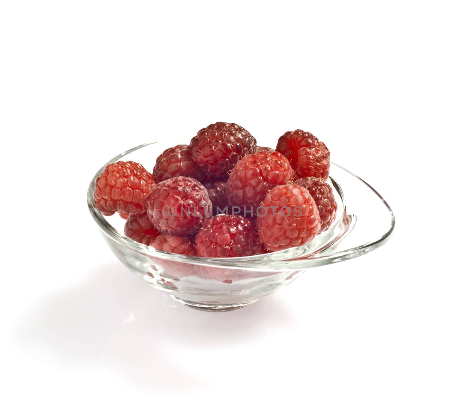freshly picked raspberries on white background