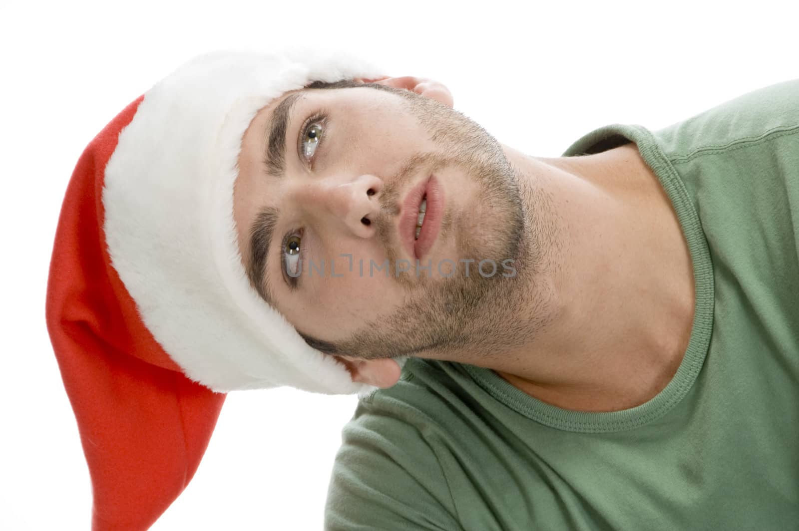 man with santa cap and looking upward with white background