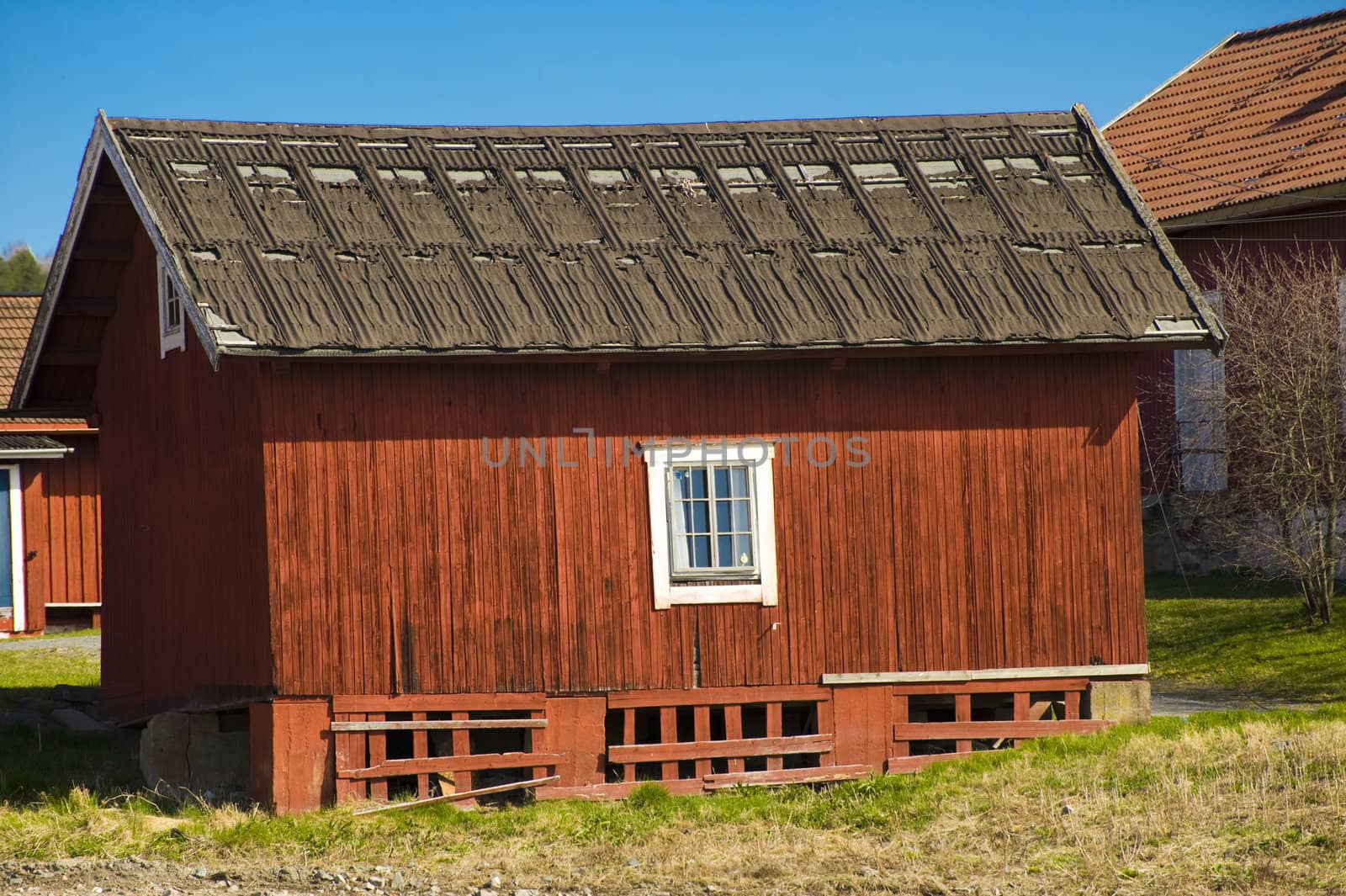 Old house in Norwegian village in  the summer day 