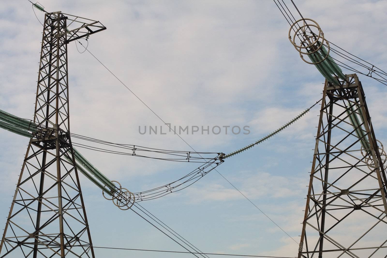 Two energy towers on sky background by serpl