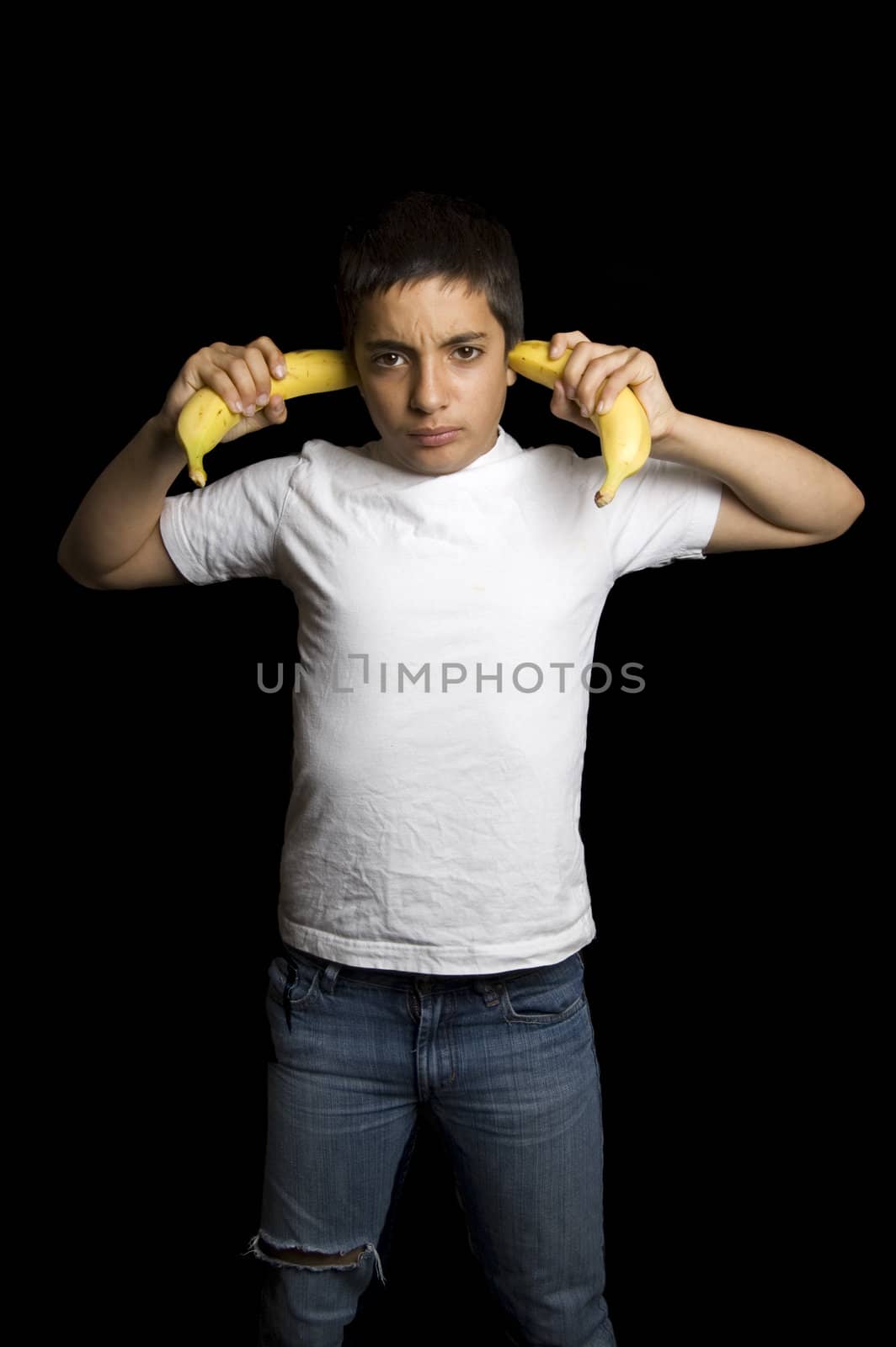 teenage boy cannot hear you because of bananas in his ears
