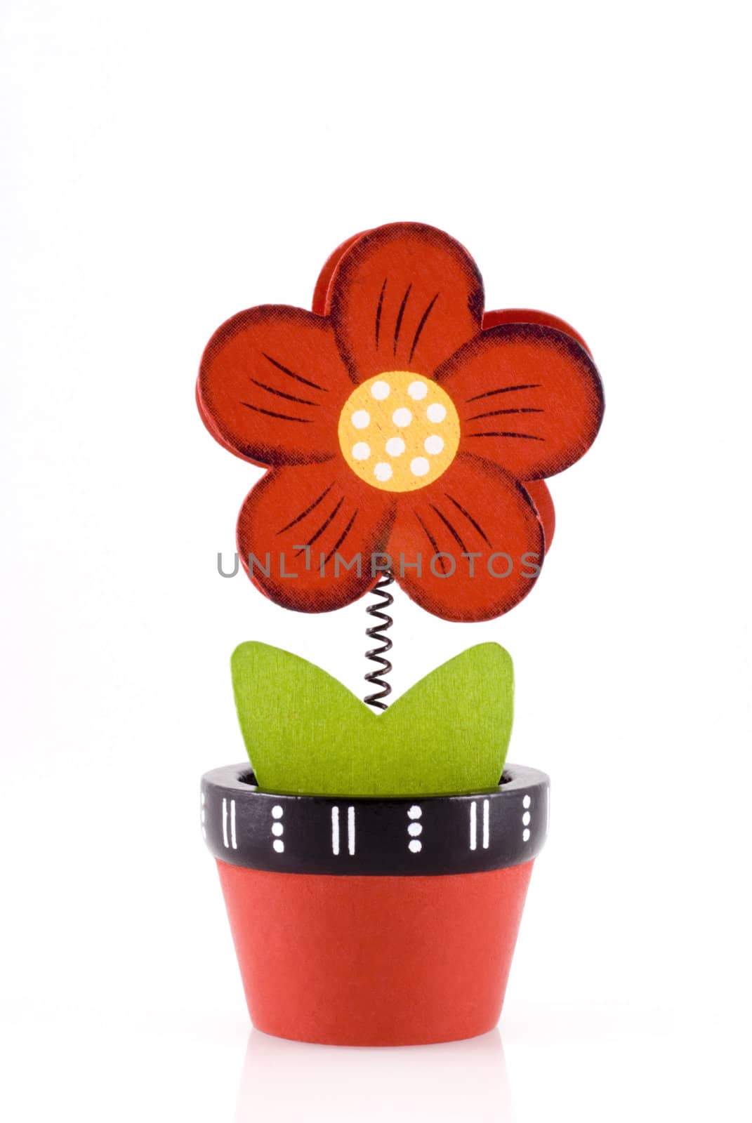 Colorful wooden flower in pot, isolated on a white background.
