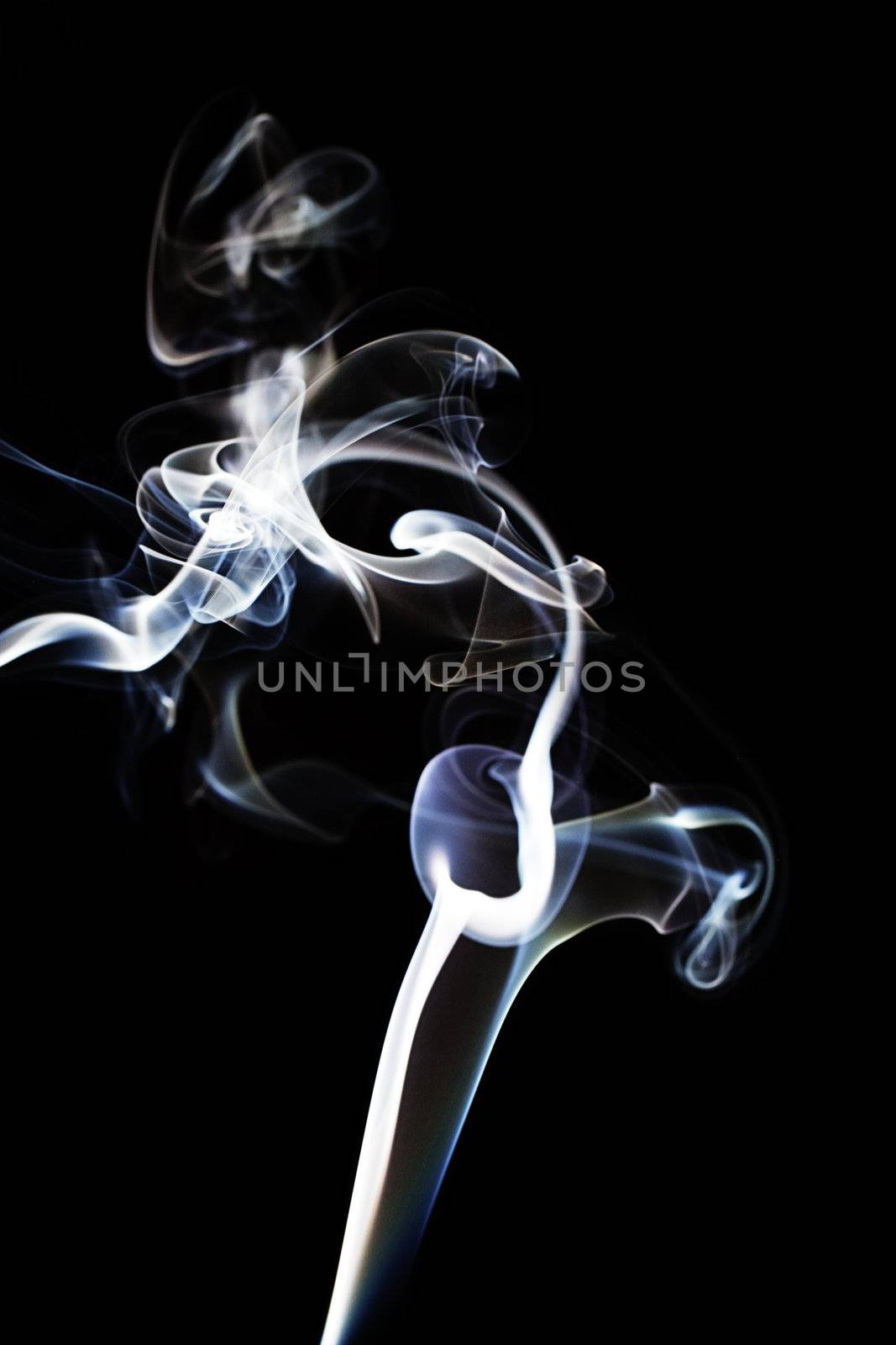 blue and white abstract and chaotic smoke on black background