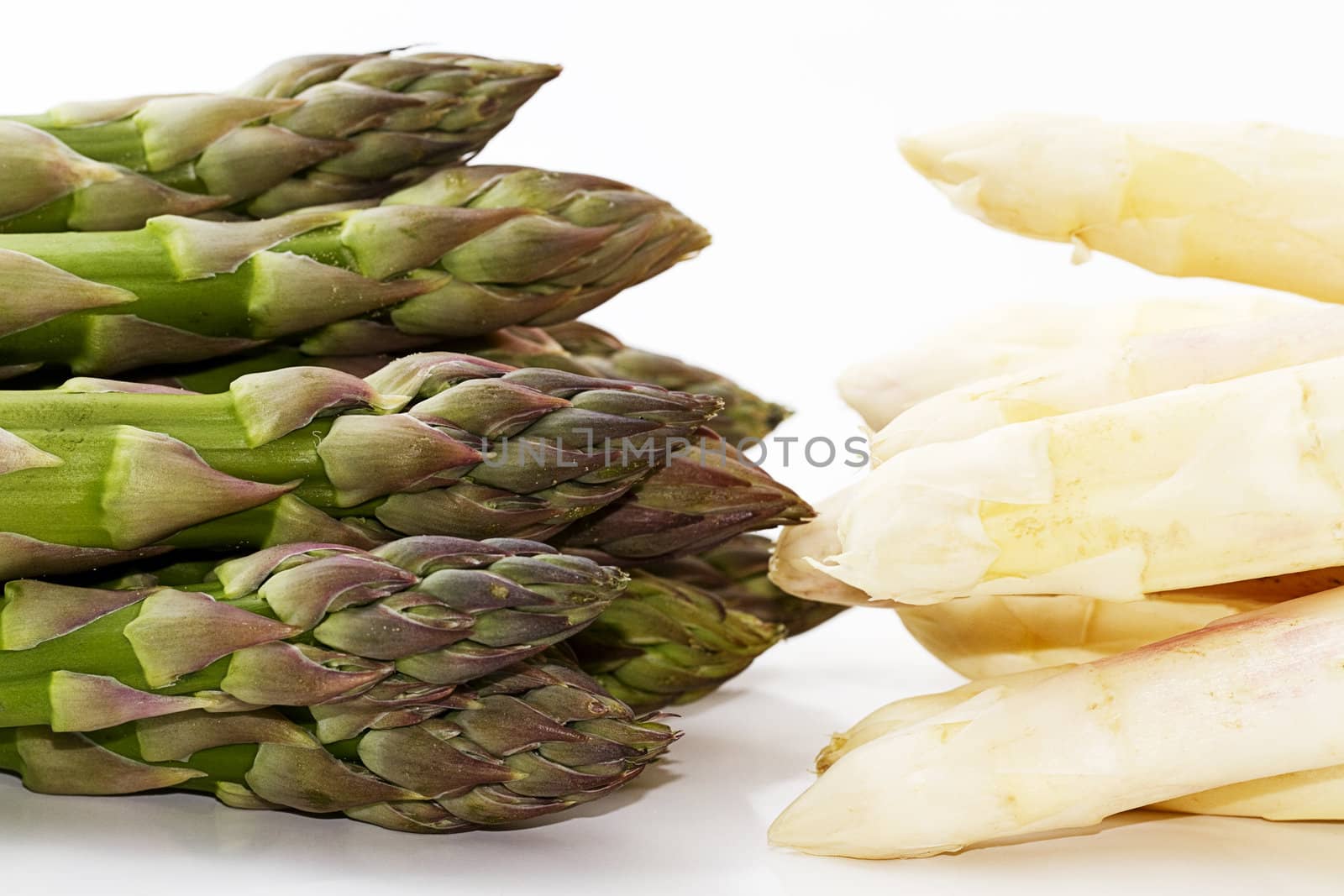 green versus white asparagus on white background