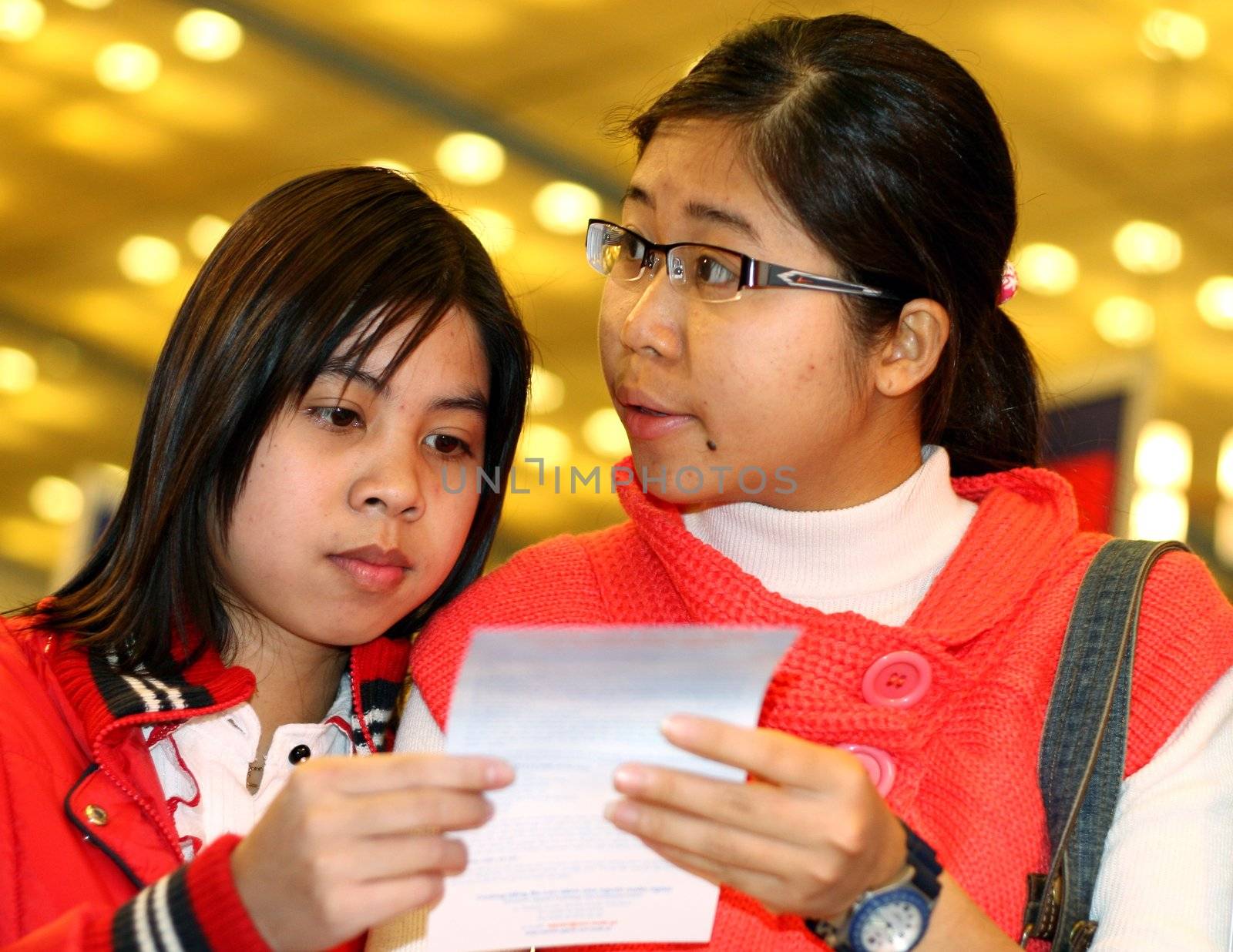 young asian schoolgirls - international educational fair