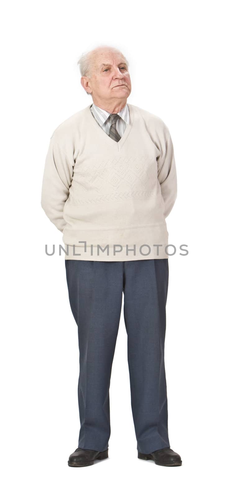 Senior man wearing a sweater standing-up against a white background.