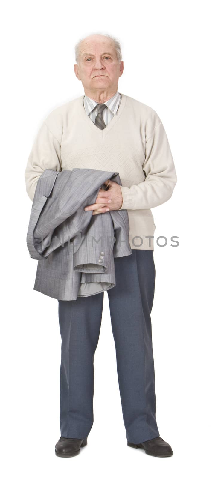 Senior man holding a coat on his arms and standing-up against a white background.