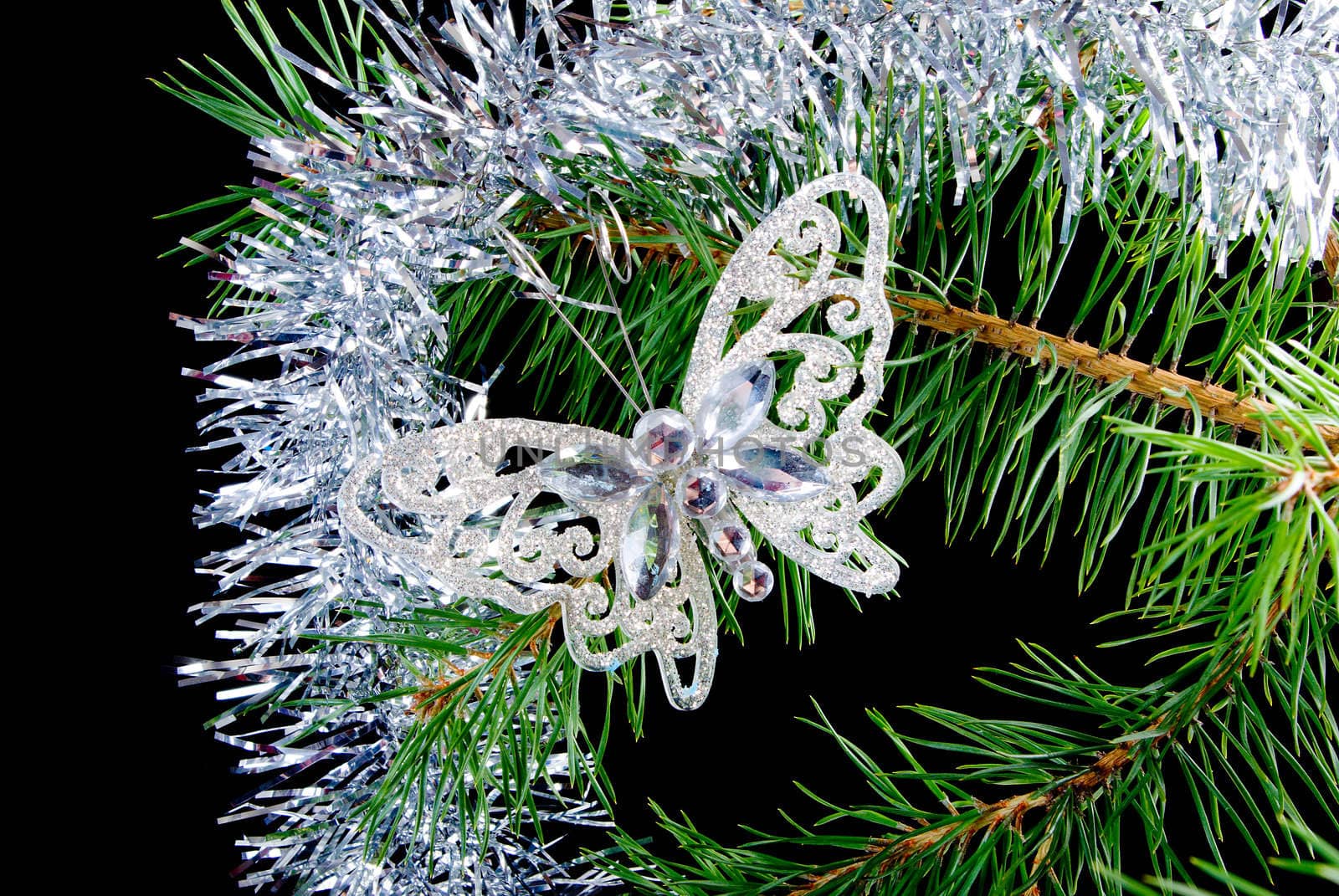 Christmas tree ornaments  on dark background .butterfly