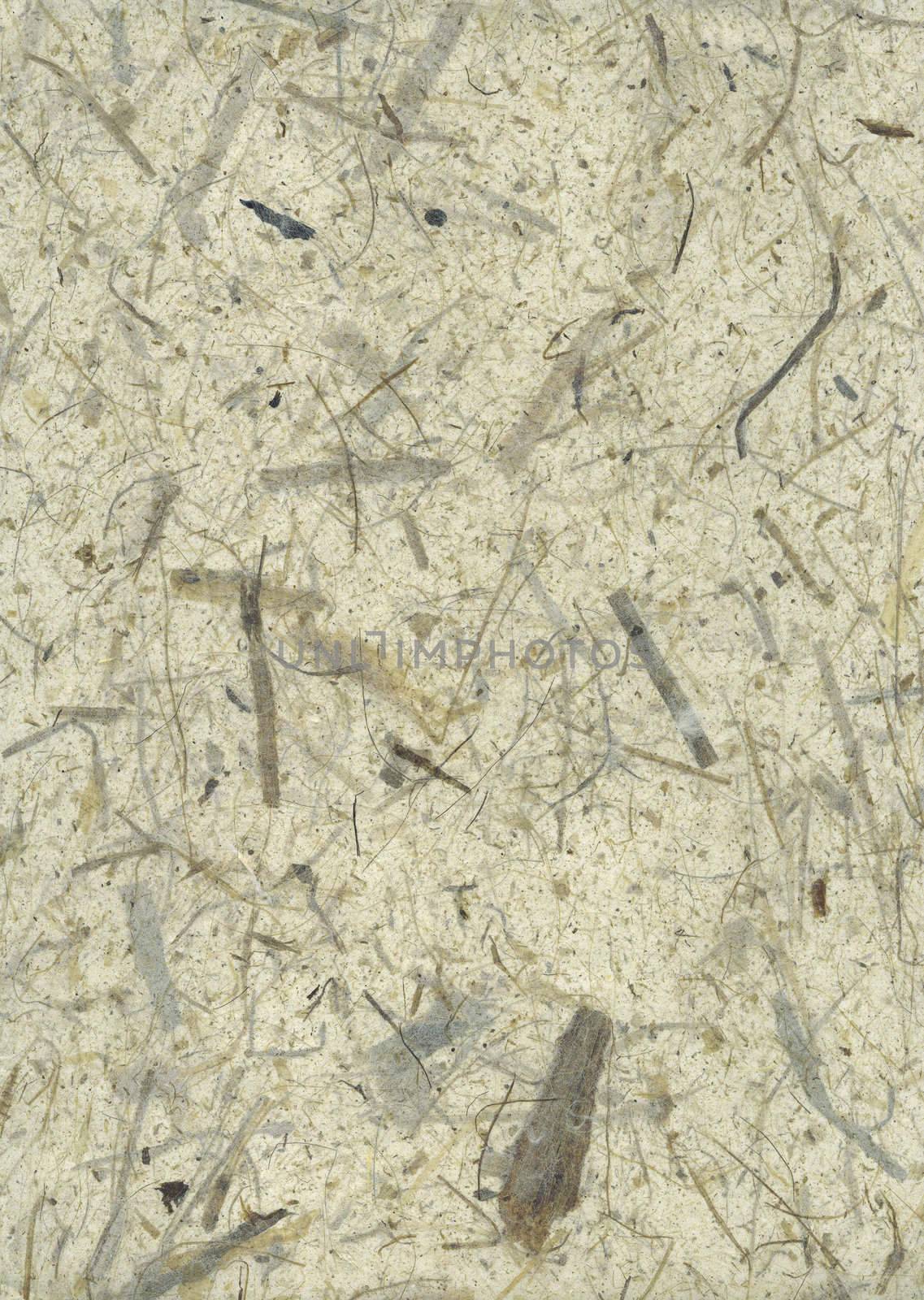 Detail of the rough surface of the handmade paper with remains of plants - natural product