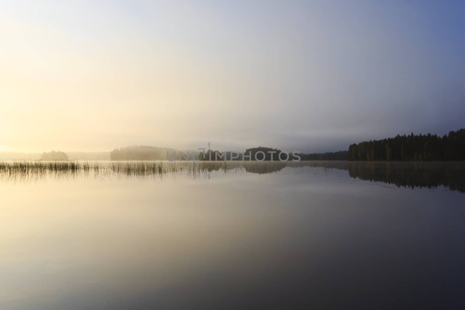 Sunrise at the lake in eastern part of Finland