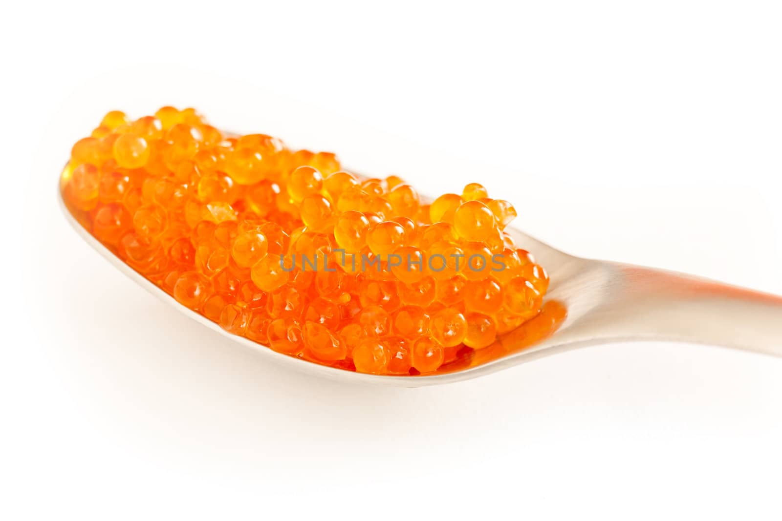 Salmon roe close up over white background