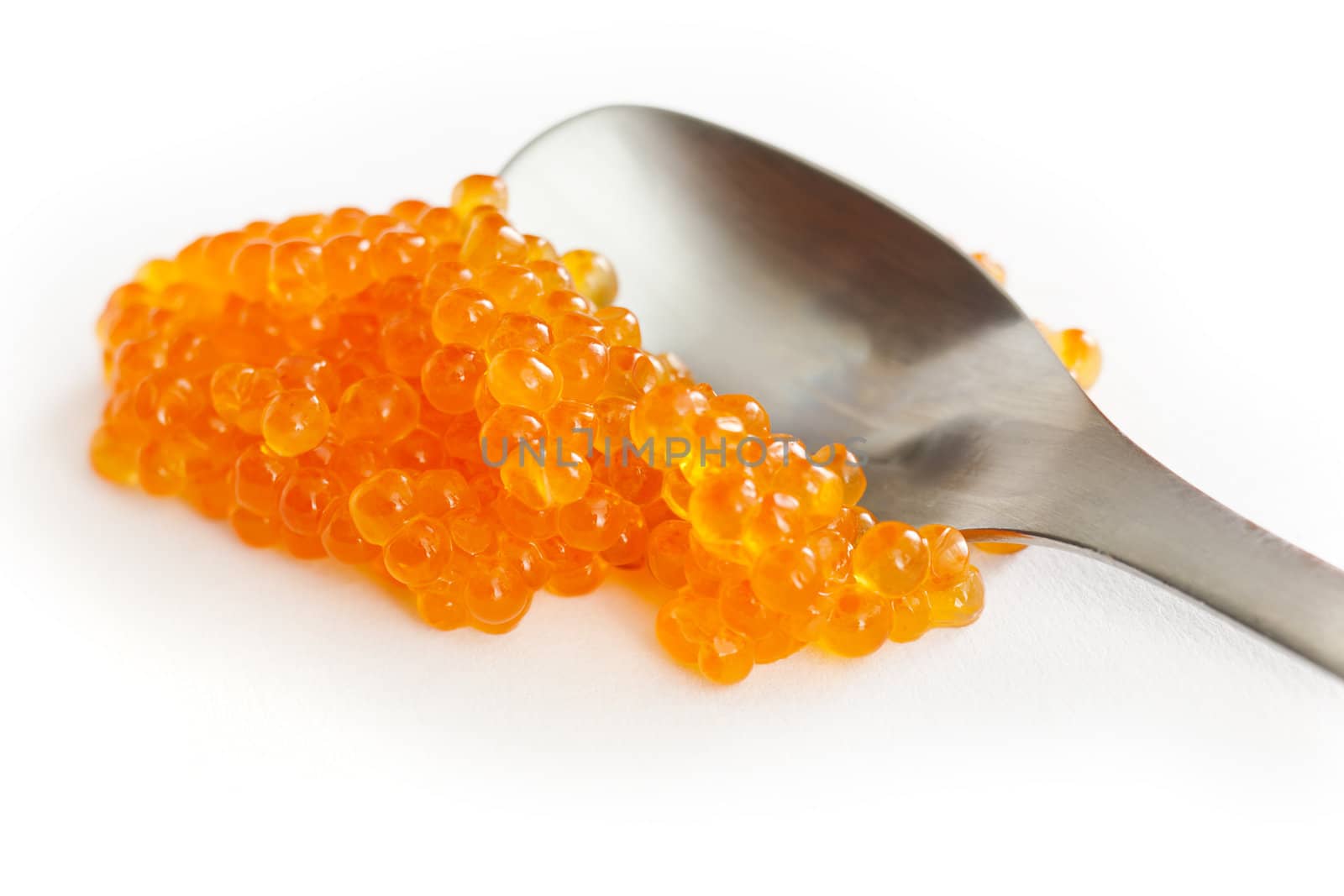 Salmon roe close up over white background