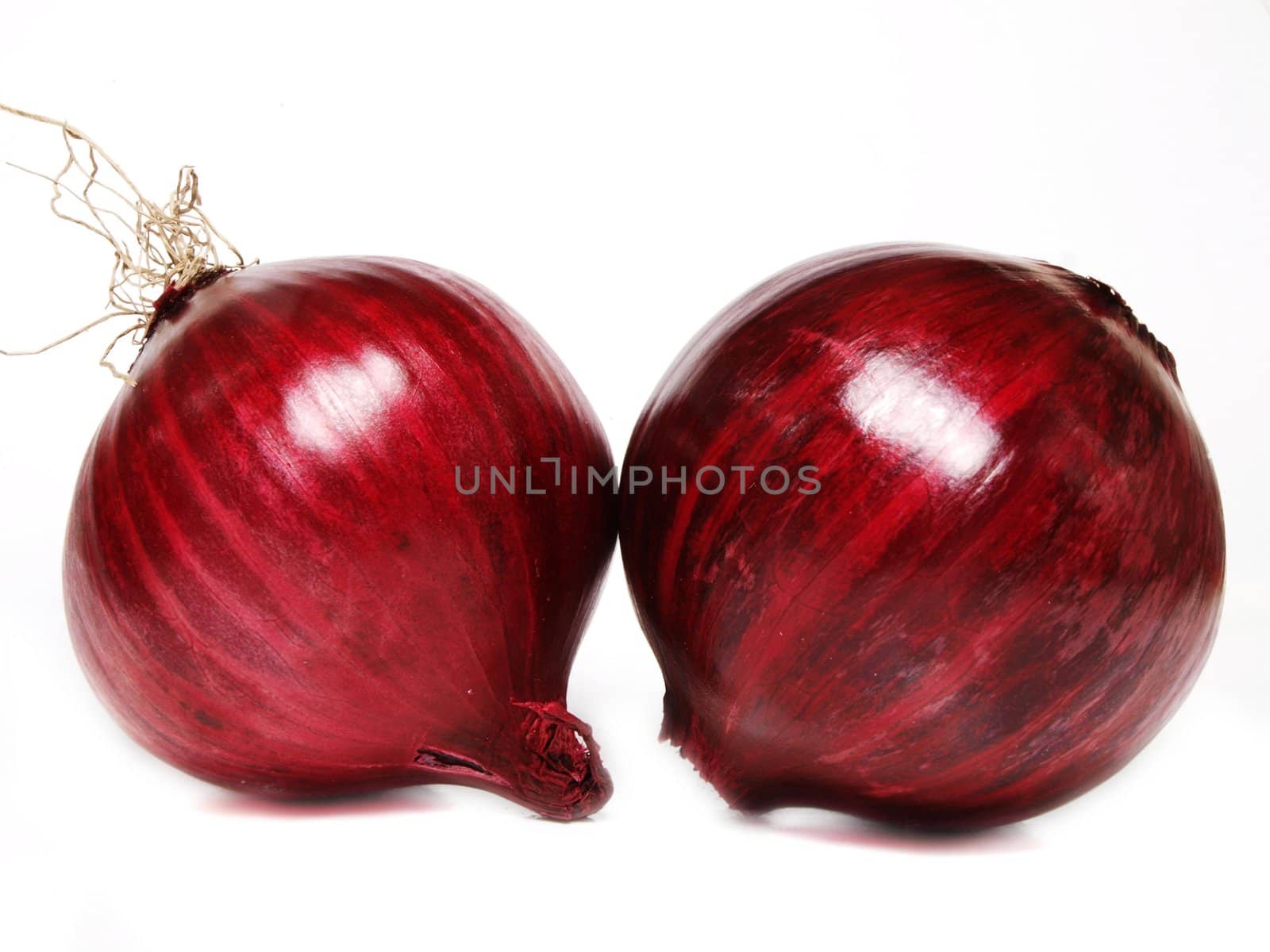 Couple of whole red onion, towards white background