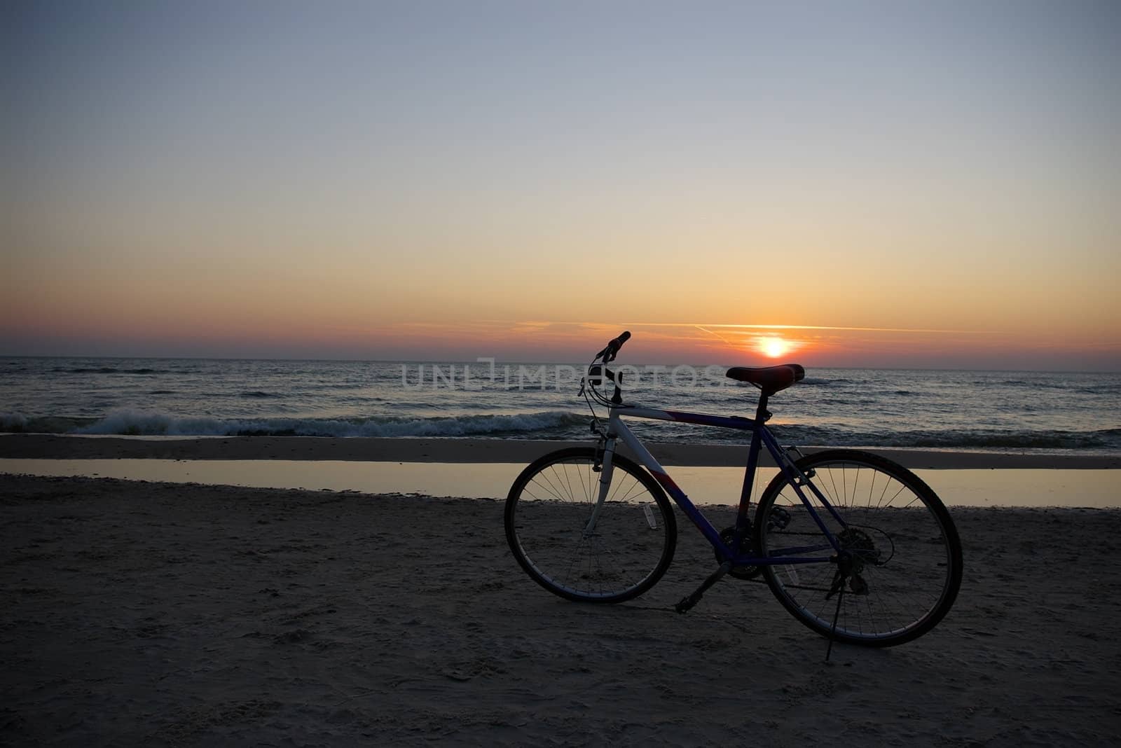 sun over bicycle seat by Dven