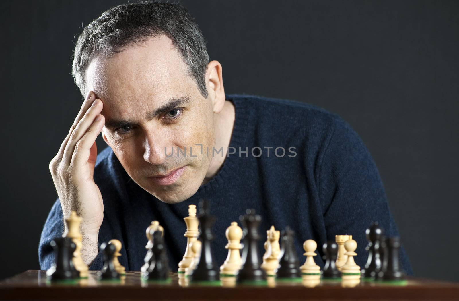 Man playing chess by elenathewise