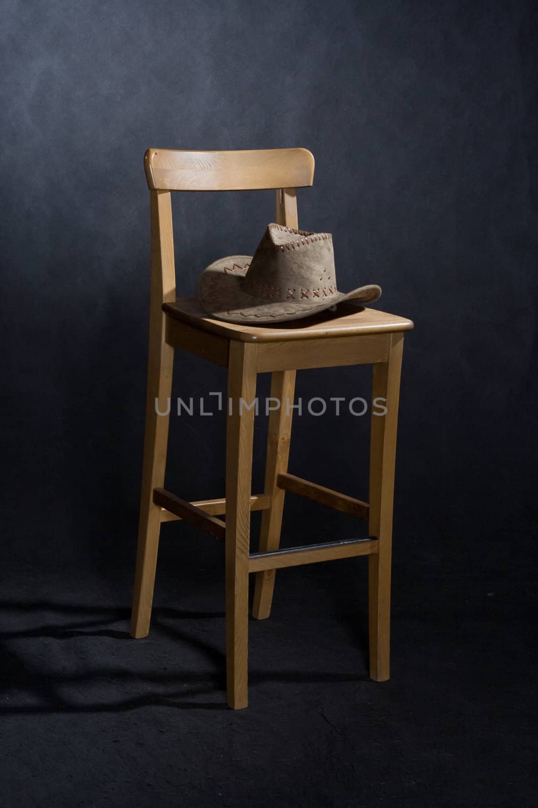 chair and western hat by foaloce