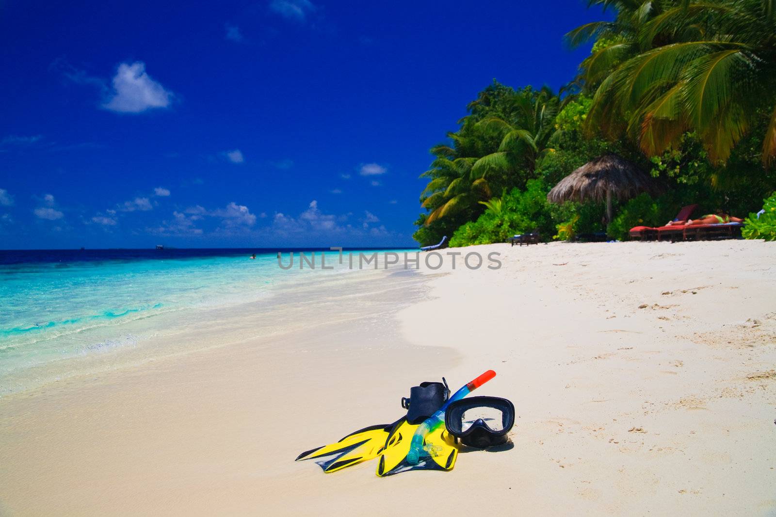 snorekl equipment on white sand beach at Maldives