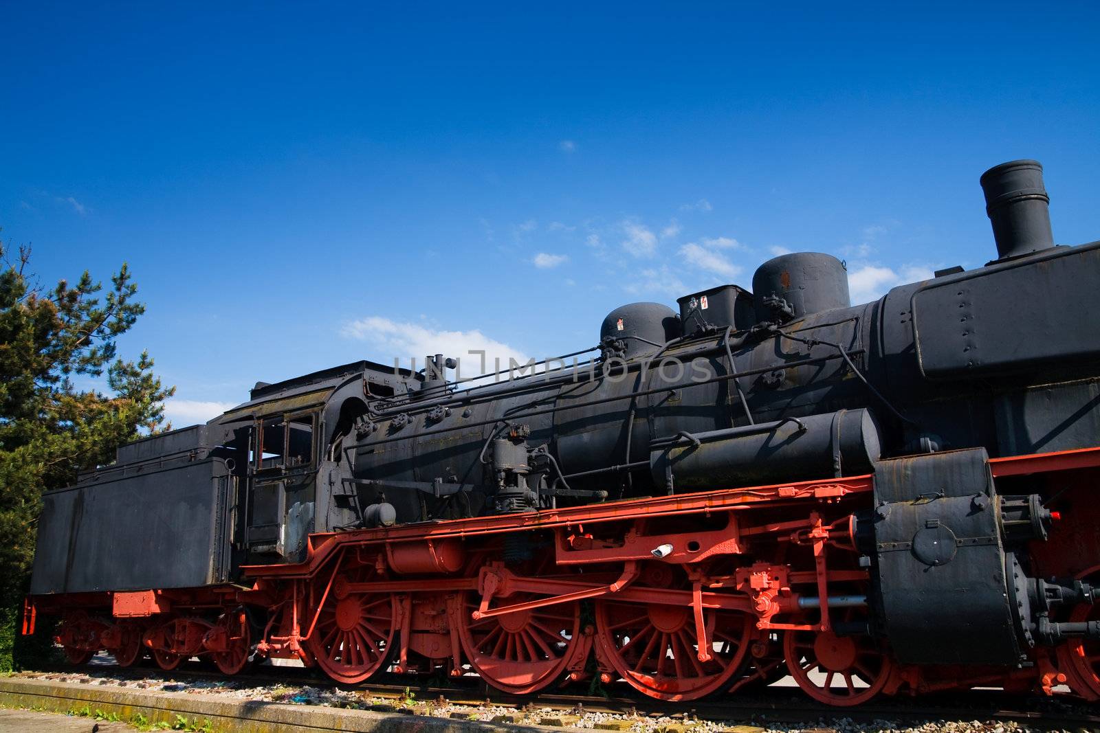 A steam locomotive standing at a station