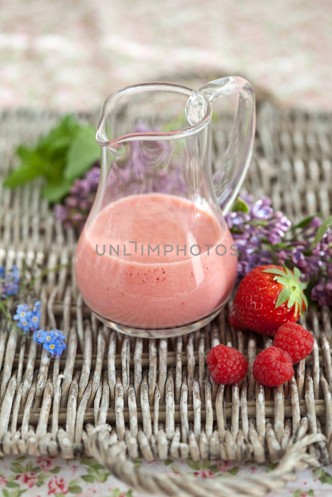 Delicious smoothie with strawberries and raspberries