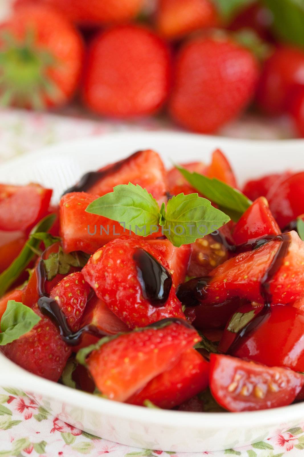 Delicious and healthy; strawberry tomato salad with balsamic glaze