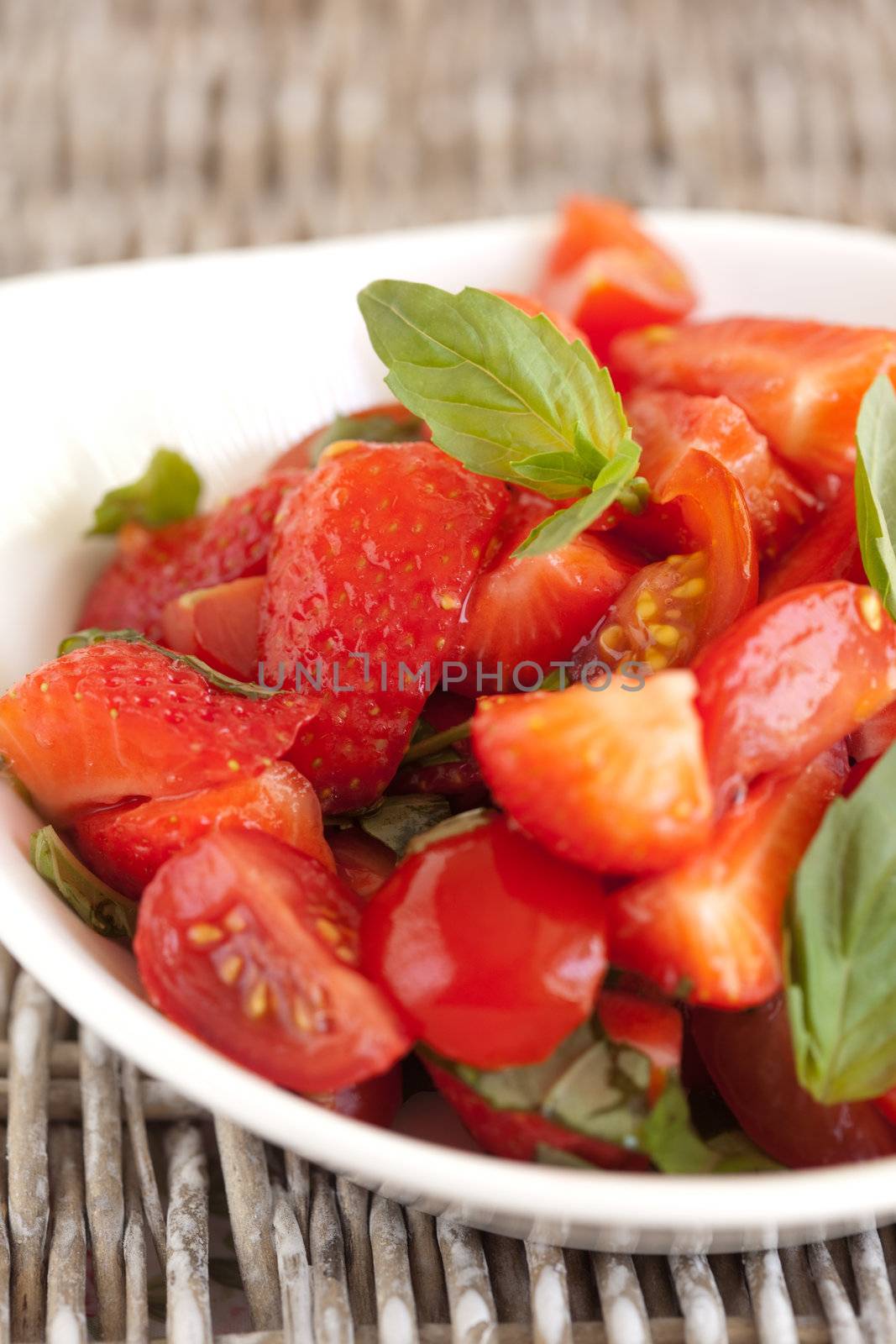 Delicious salad with strawberries and tomatoes