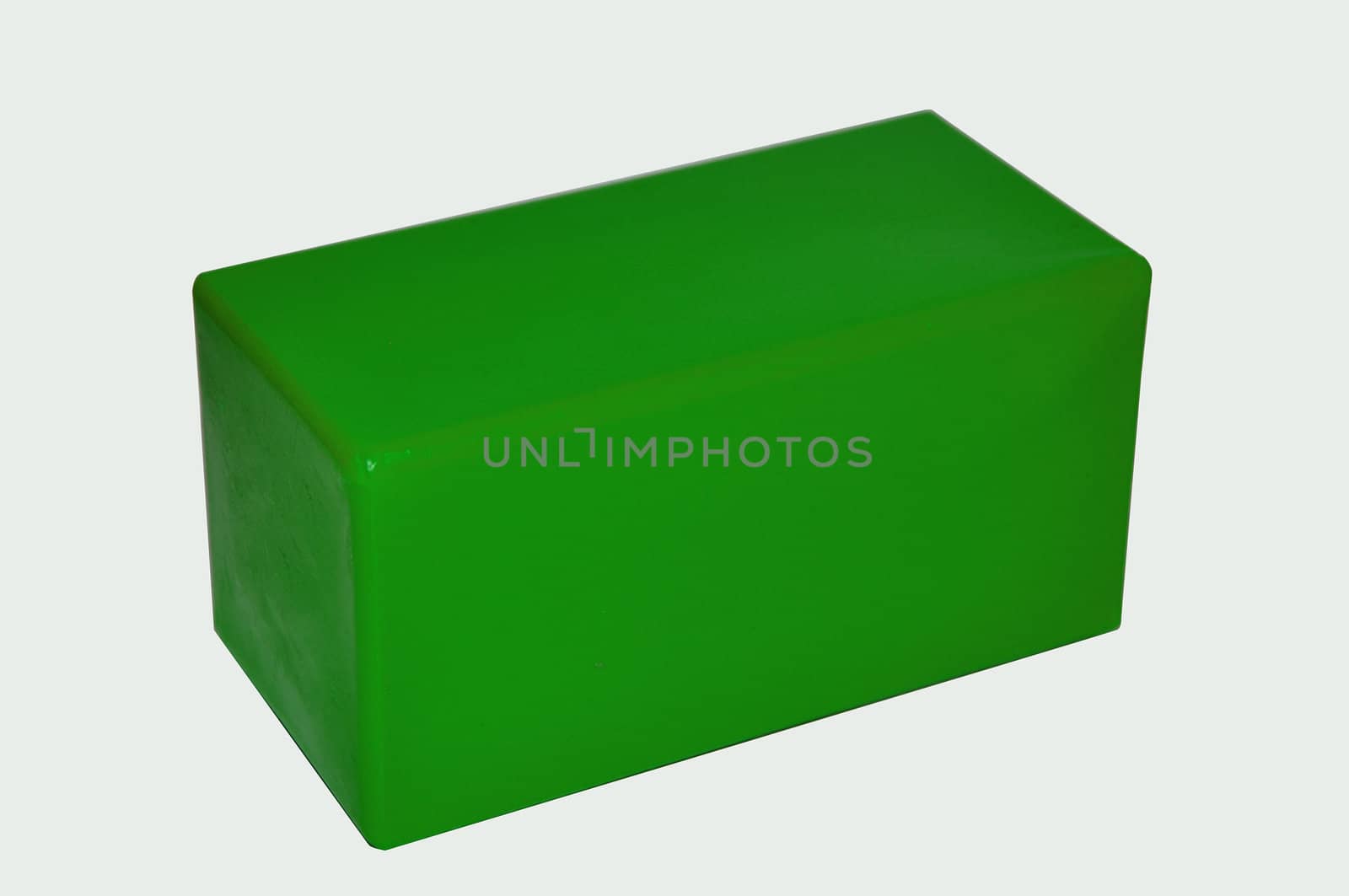 Green plastic cube an element of a game pyramid