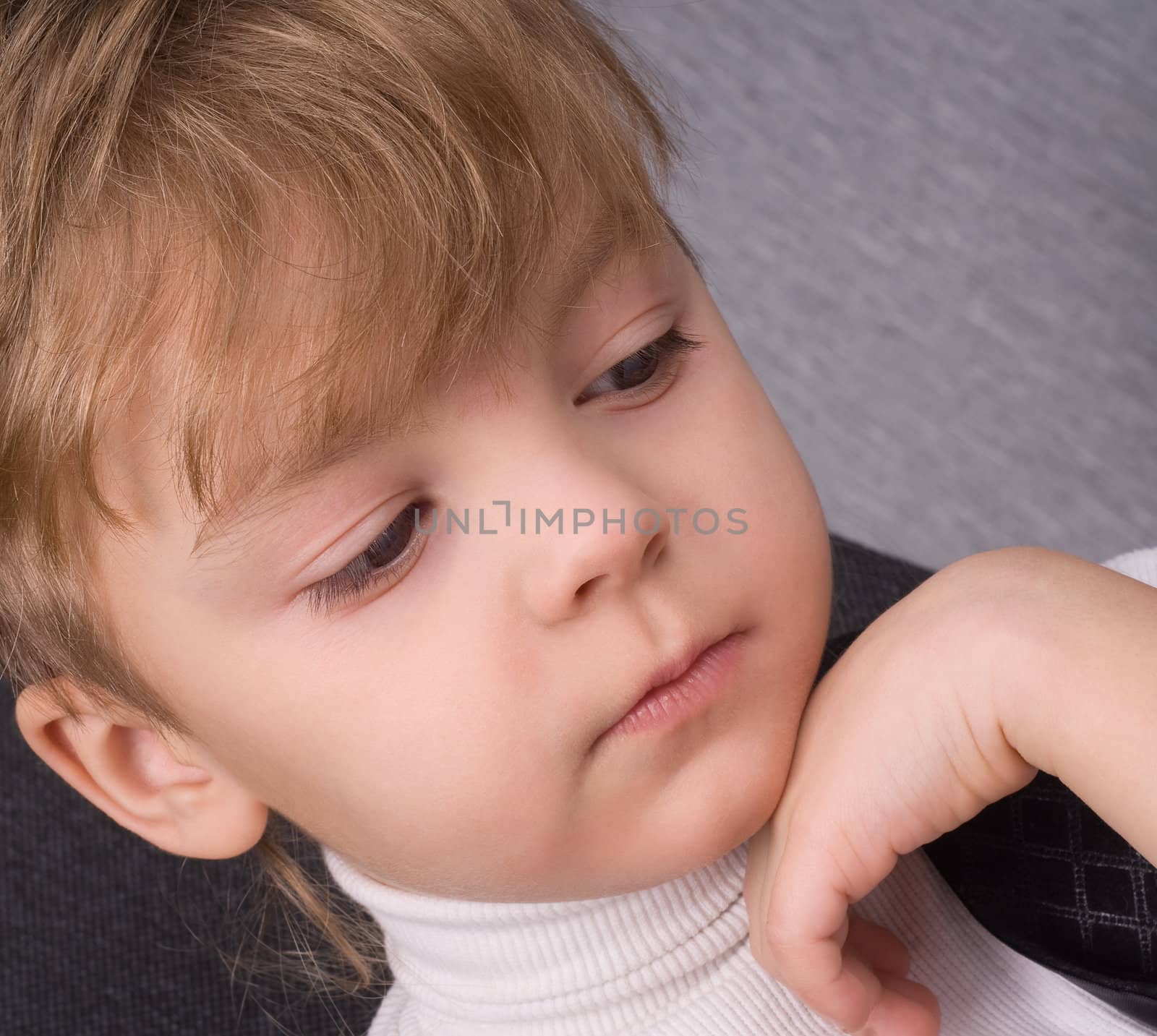 Six years boy reading a book at home