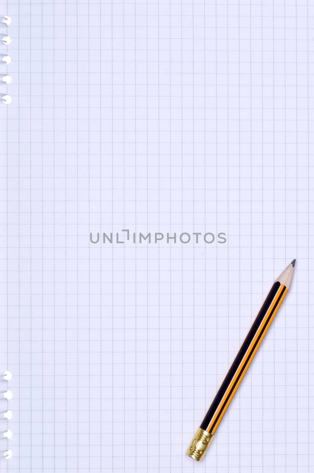 Close-up image of pencil on paper background