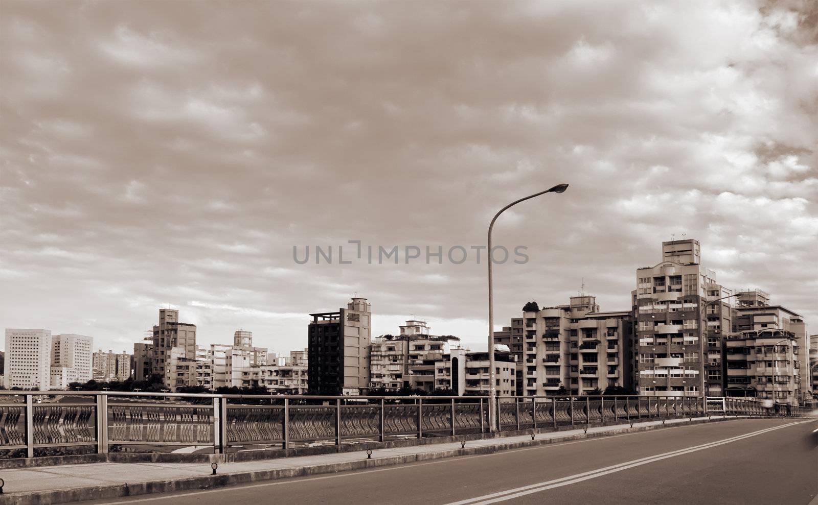 Road and buildings under the dramatic sky in Taipei, Taiwan.