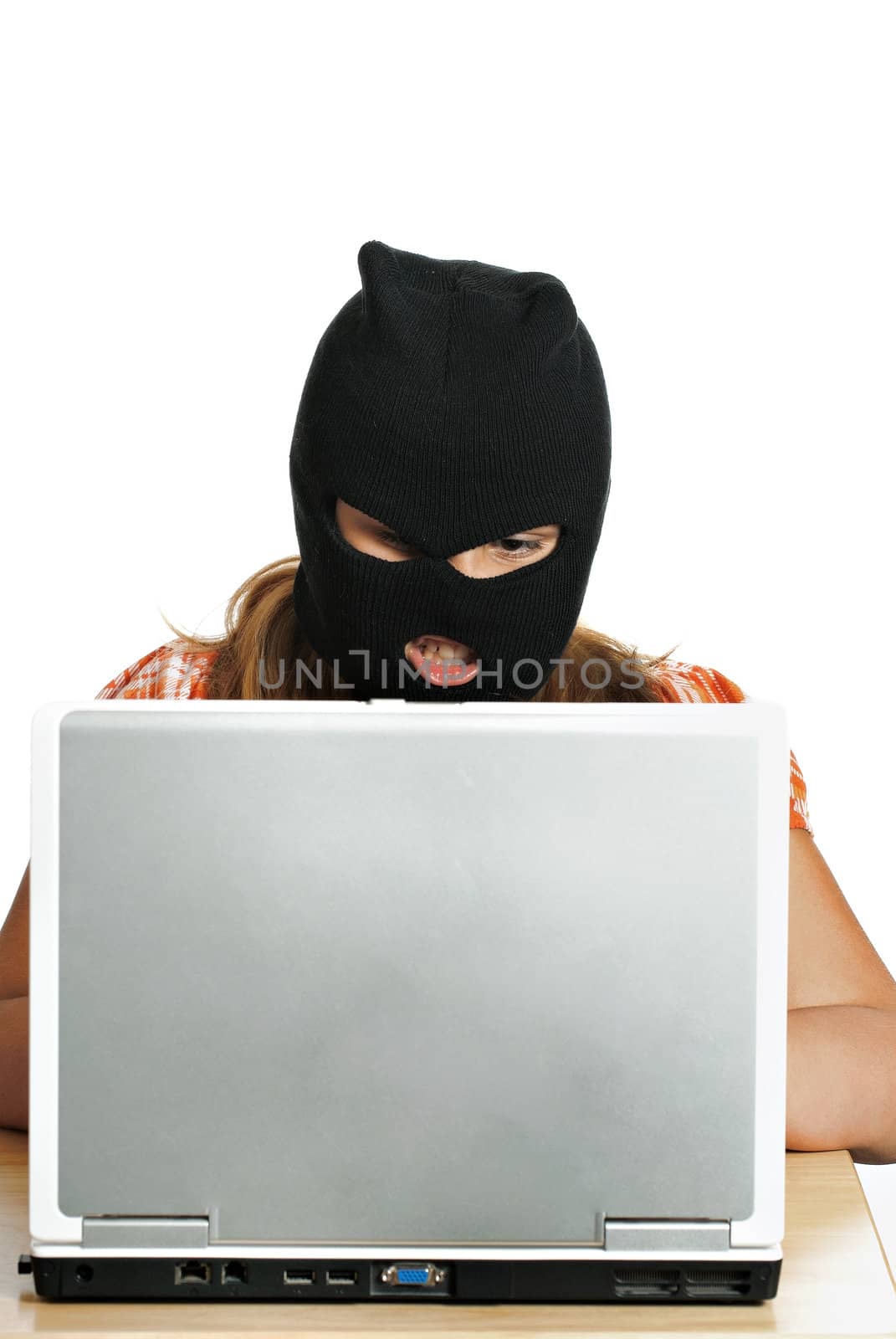 A young child hacker is working on a computer, isolated against a white background.