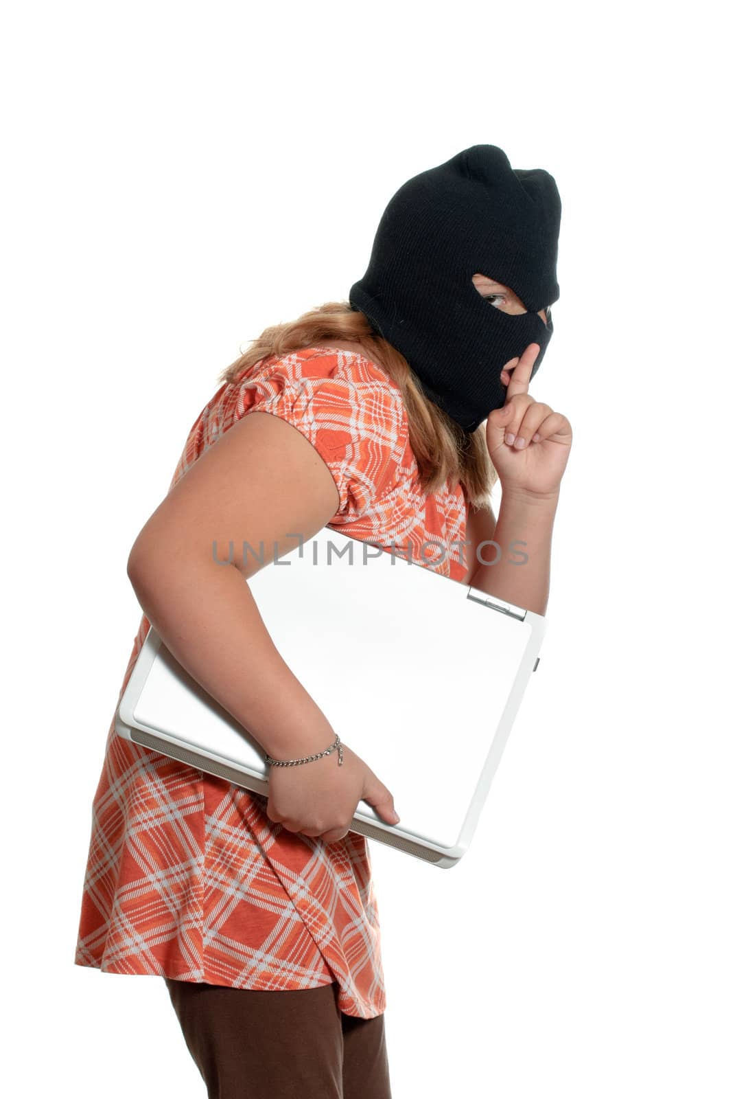 A young girl is stealing a laptop, isolated against a white background.