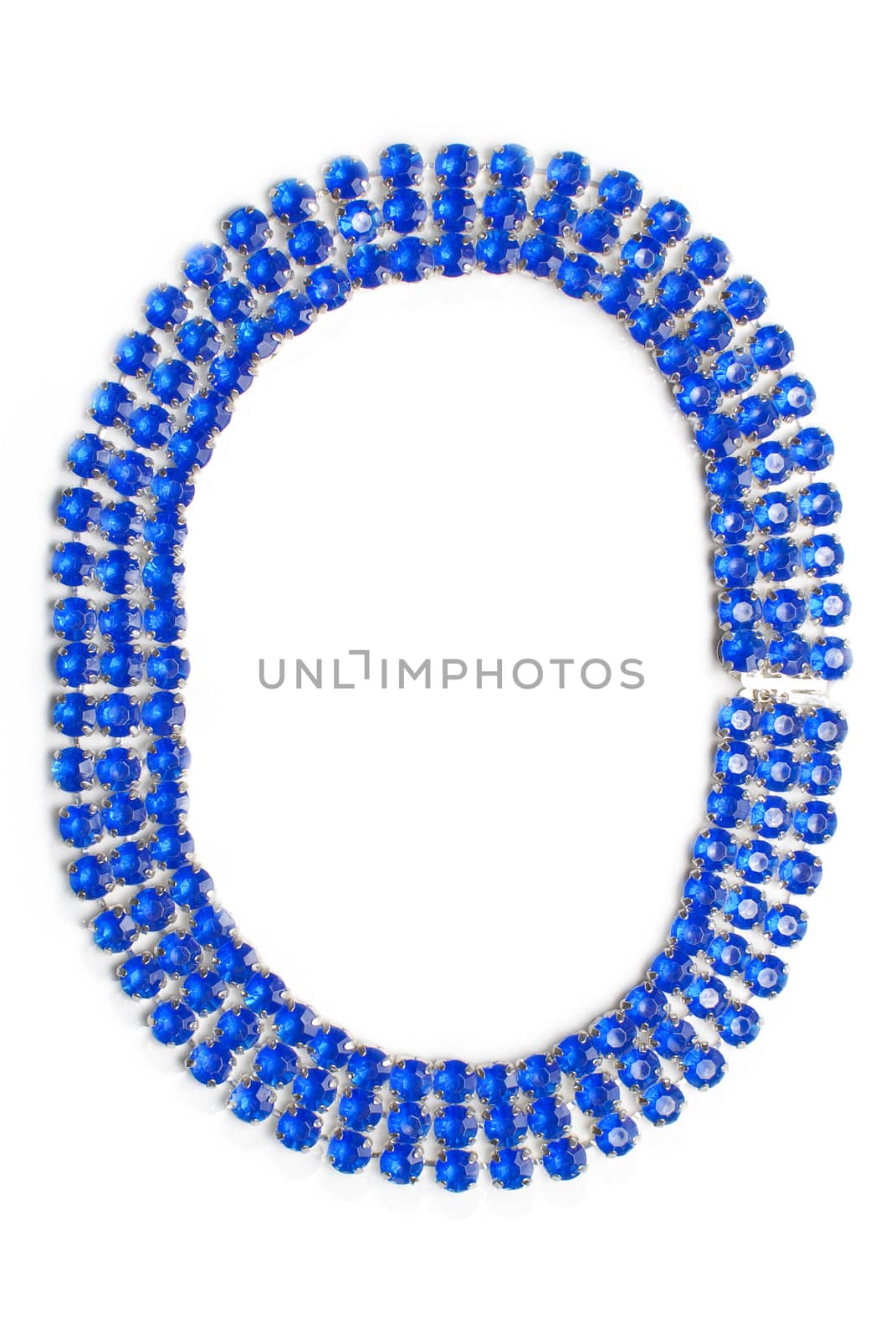 Circled bijouterie necklace made from silver metal and blue stones isolated on white background