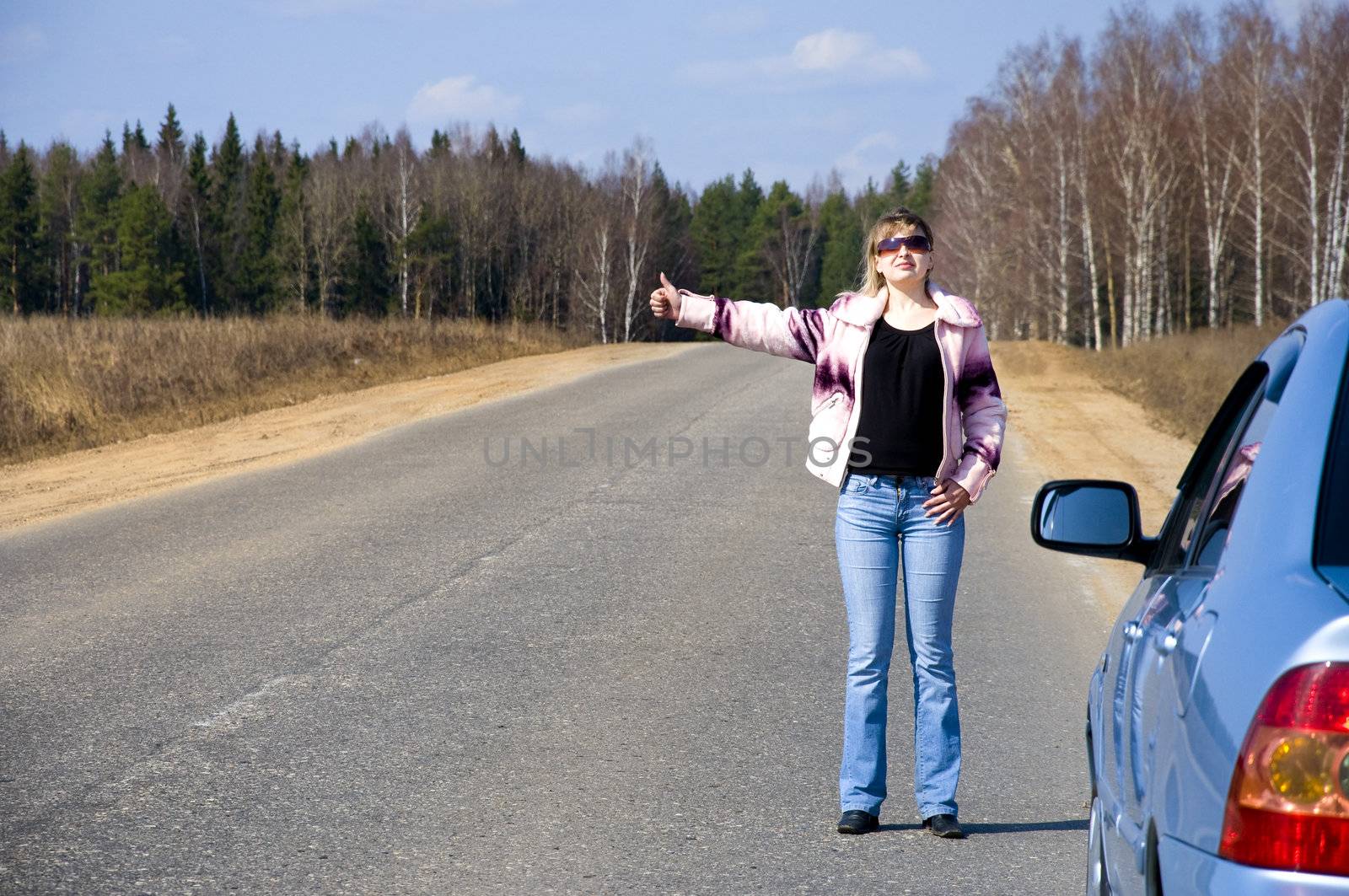 sexy woman stopping car girl hitchhiking on the road alone