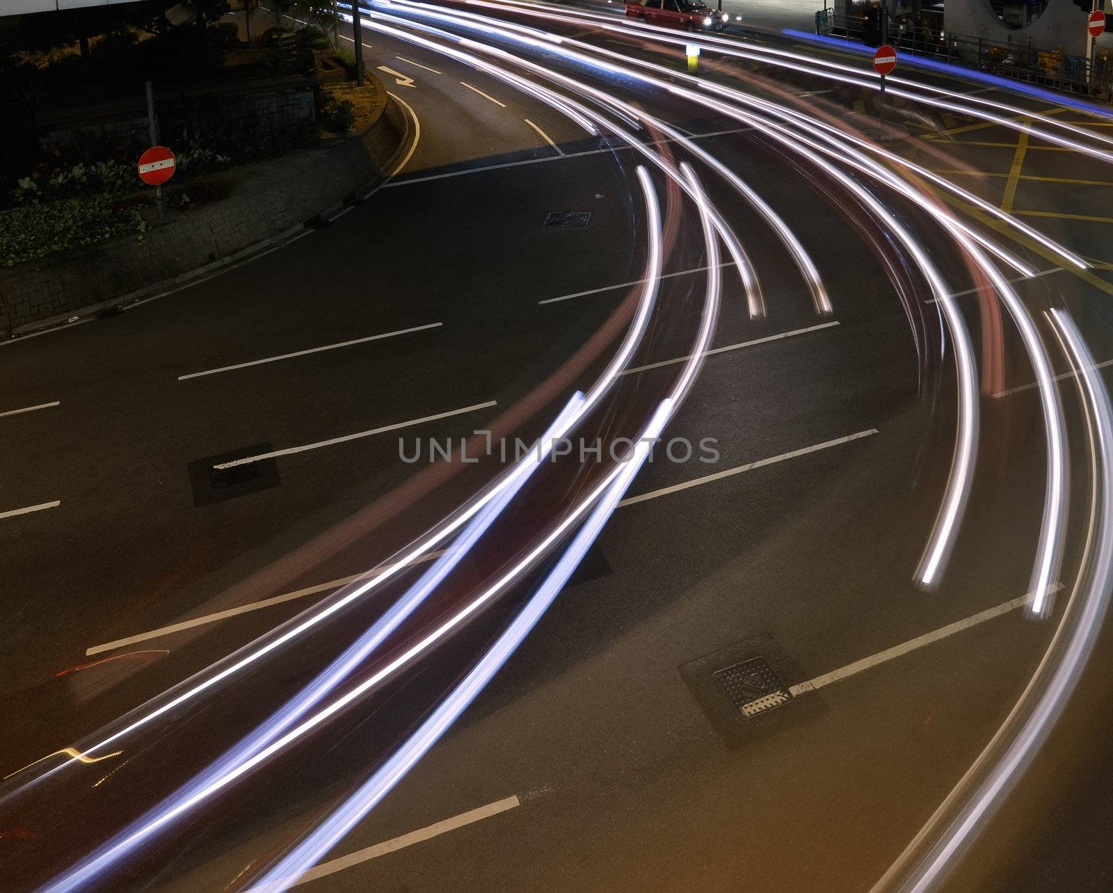 Car light trace in night of modern city.