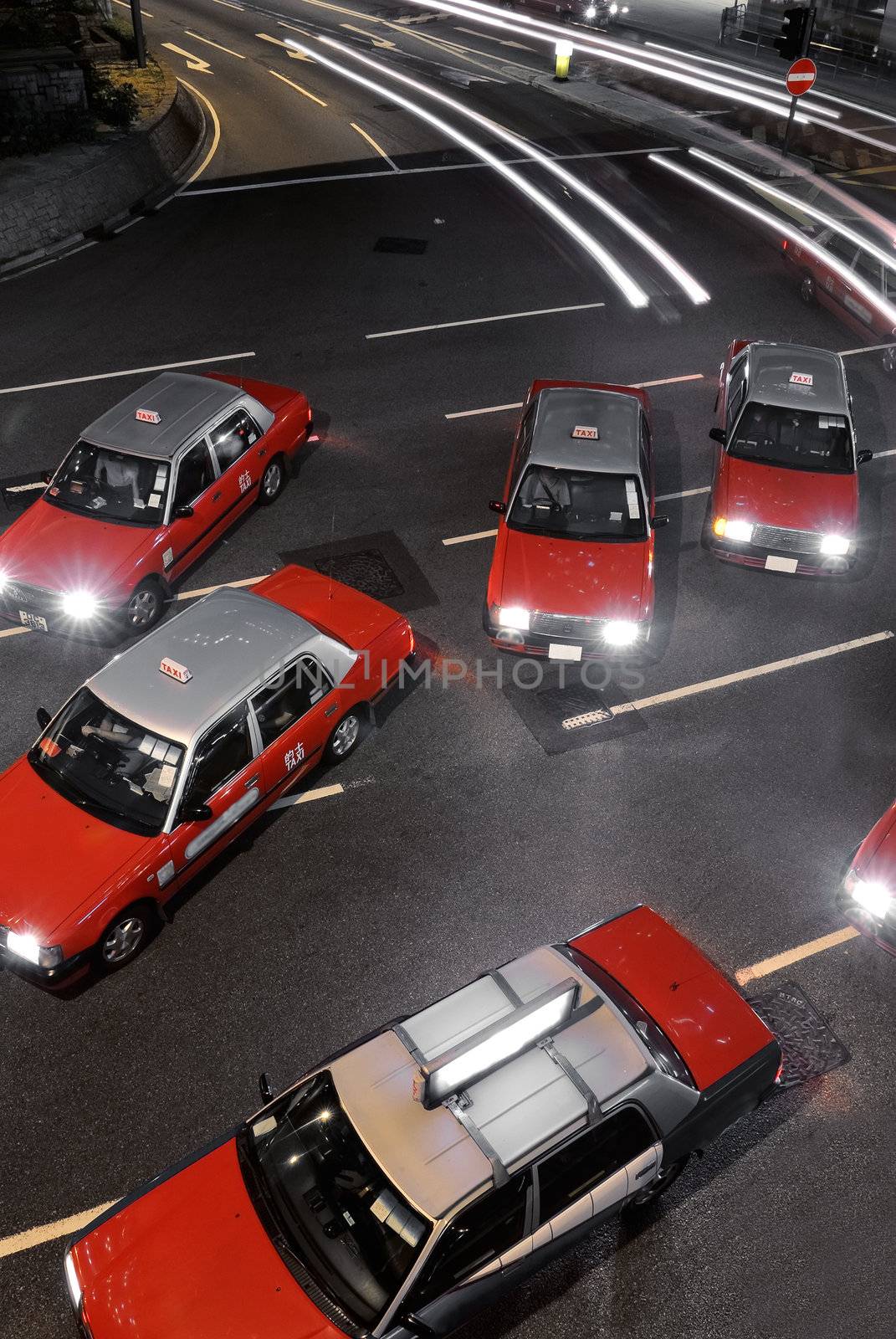 Taxi in night of Hong Kong, stop and crowed.