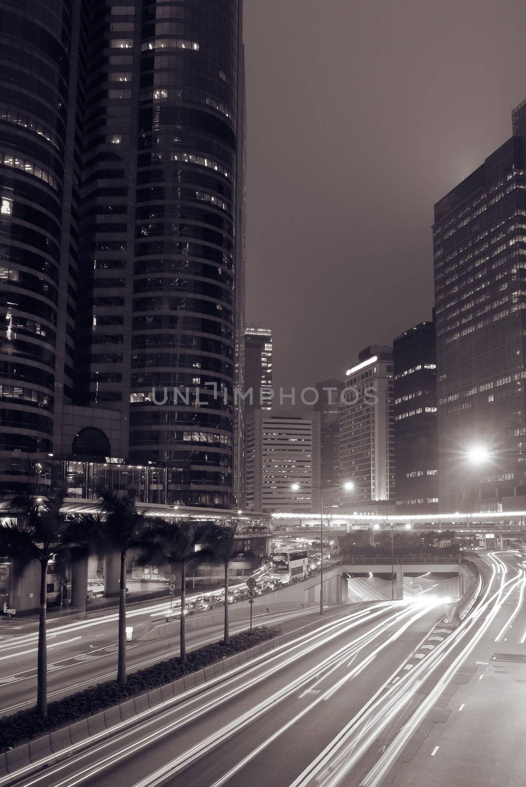 Modern city night with cars motion blurred.