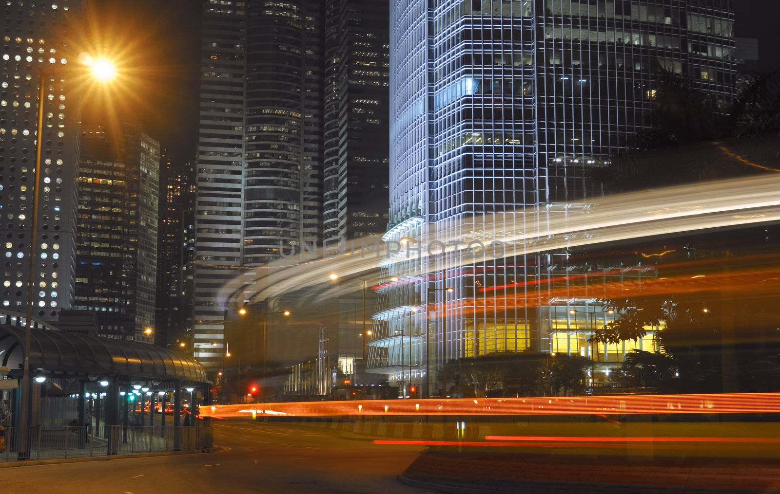 Modern city night with car motion blurred.