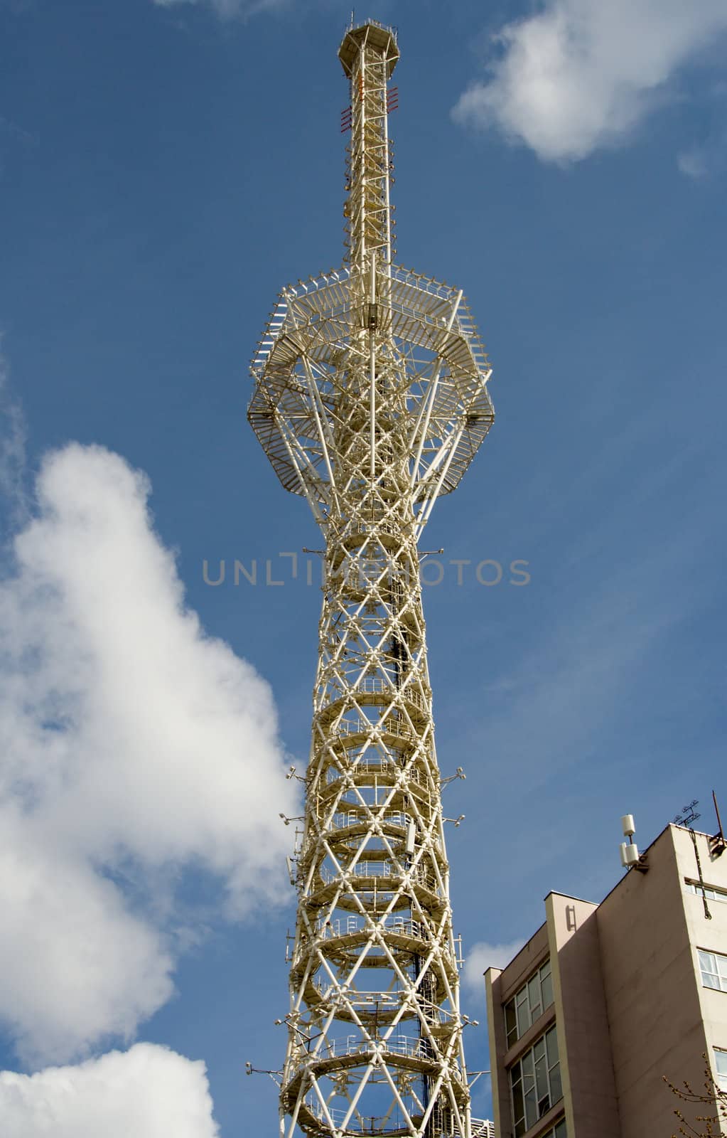 Television tower on a background of clouds