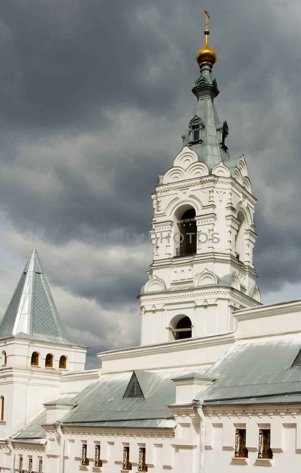 Christian temple with domes on a background of clouds