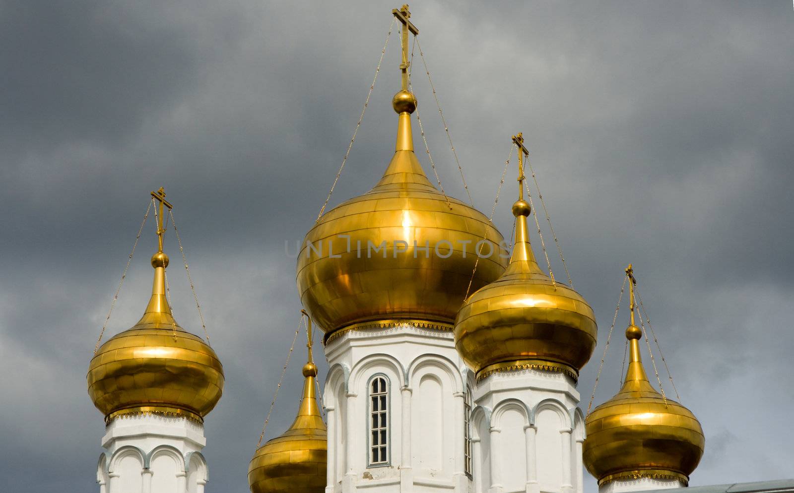 Christian temple with domes on a background of clouds