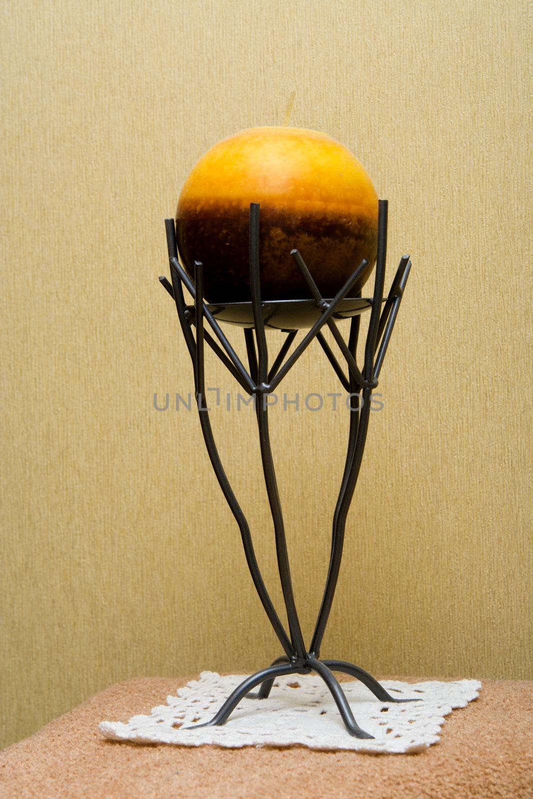 Decorative candlestick with a spherical candle